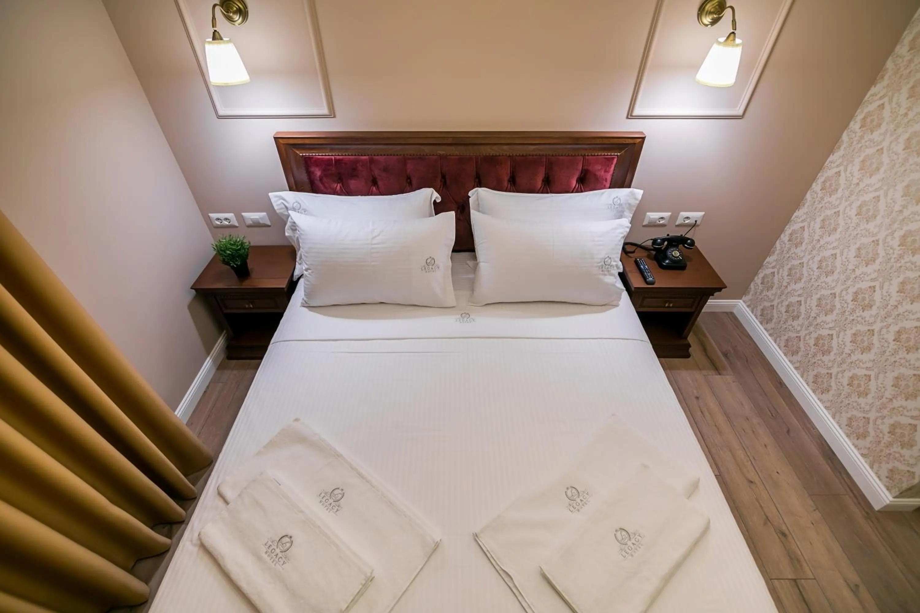 Bed in Legacy Boutique Hotel