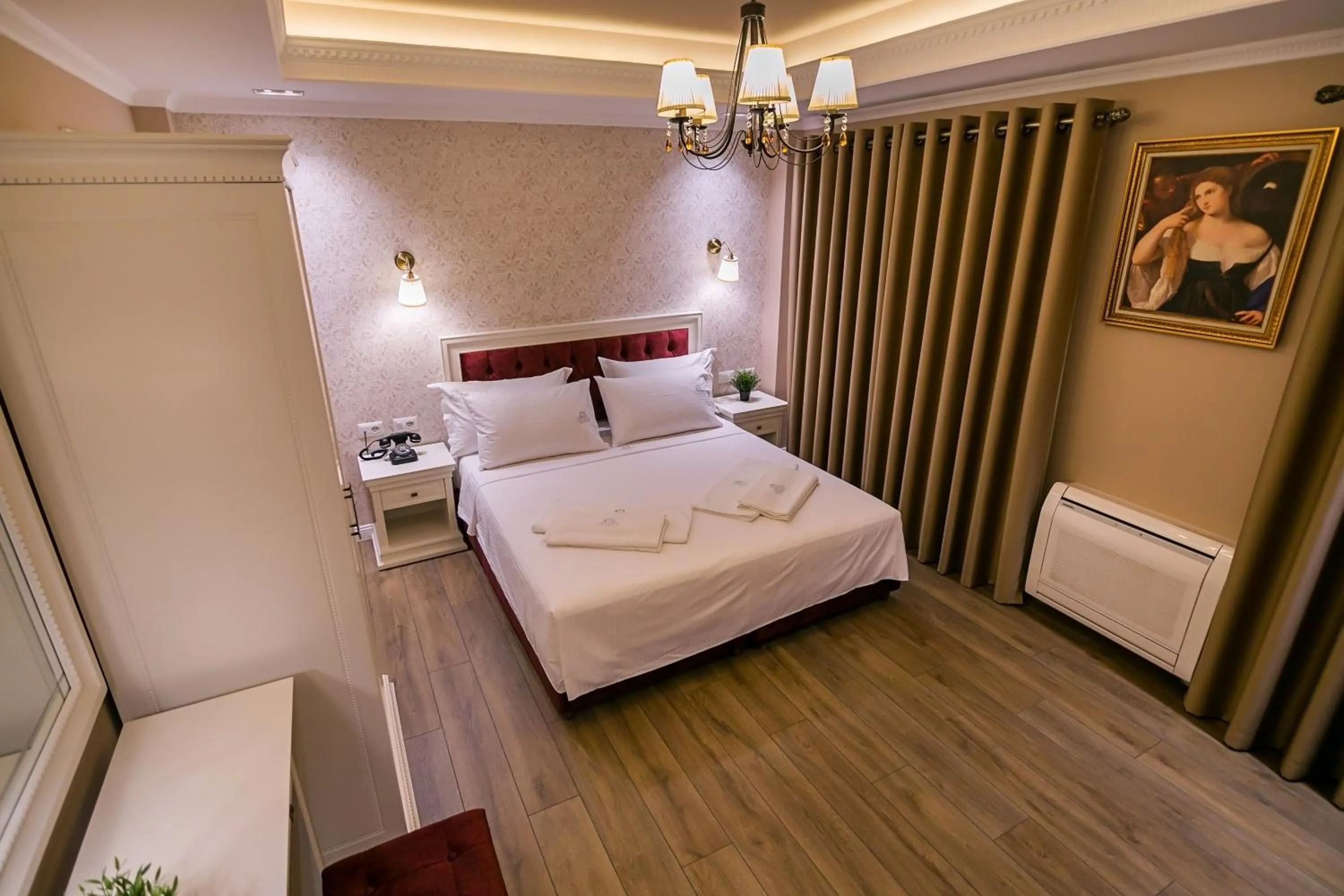 Bed in Legacy Boutique Hotel