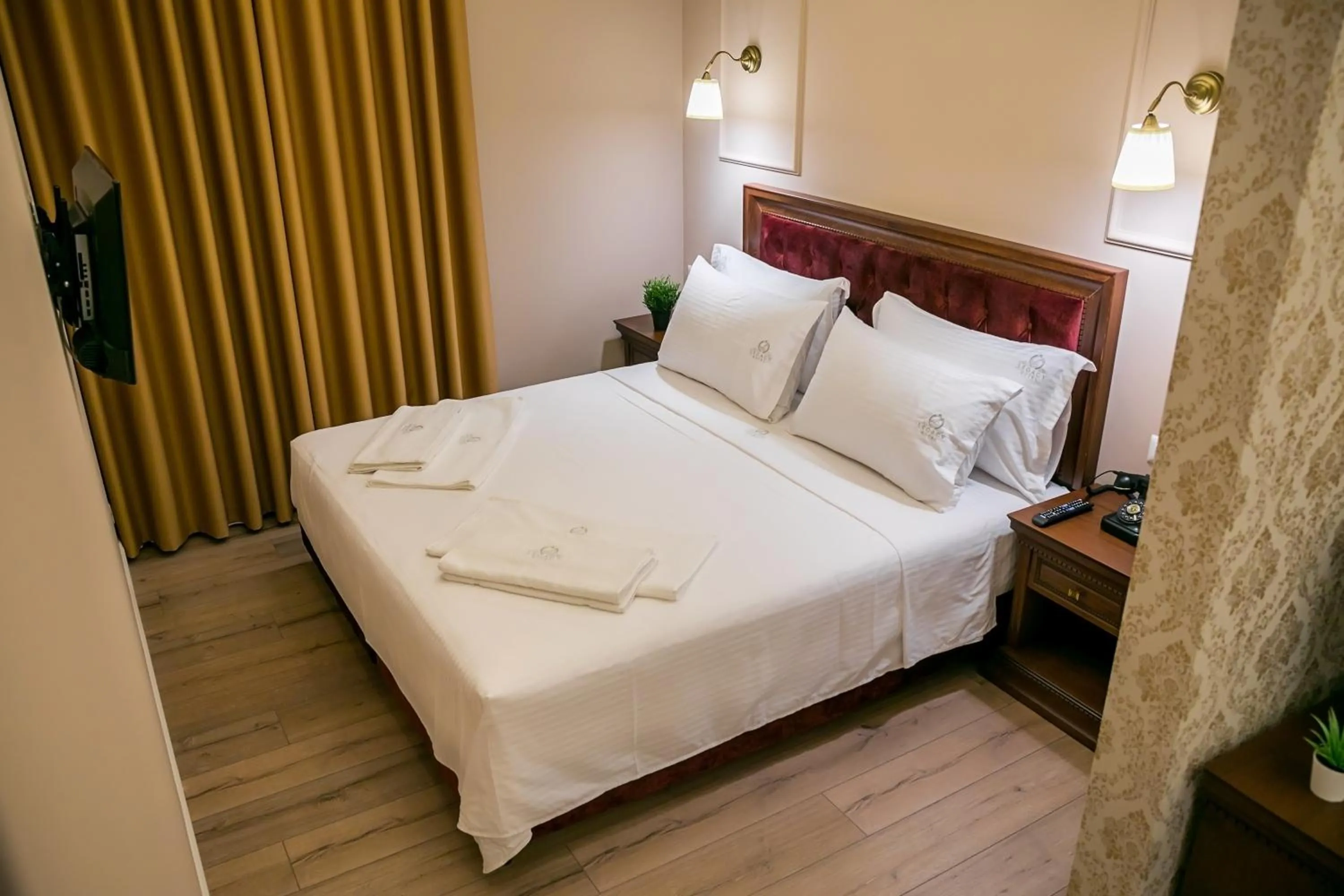 Bed in Legacy Boutique Hotel