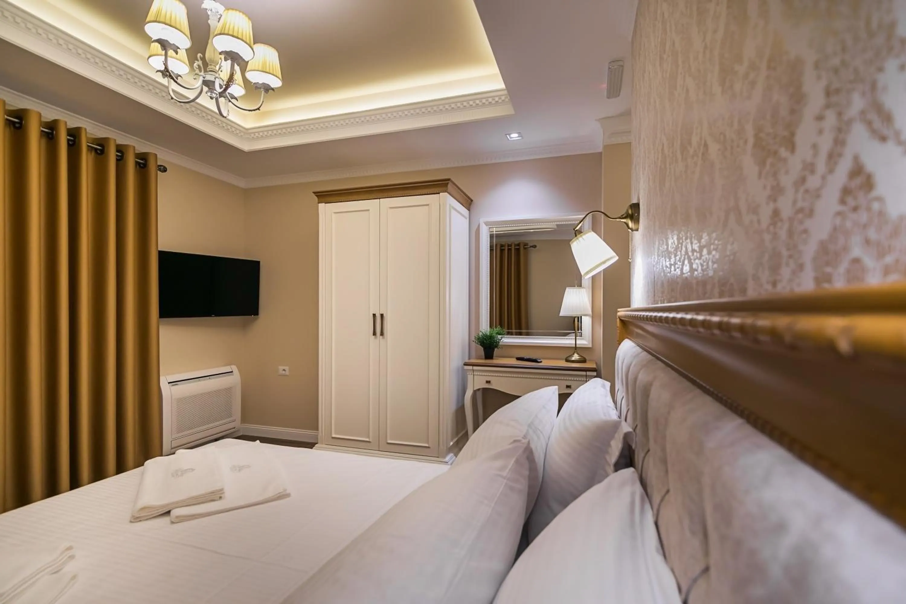 Bed in Legacy Boutique Hotel