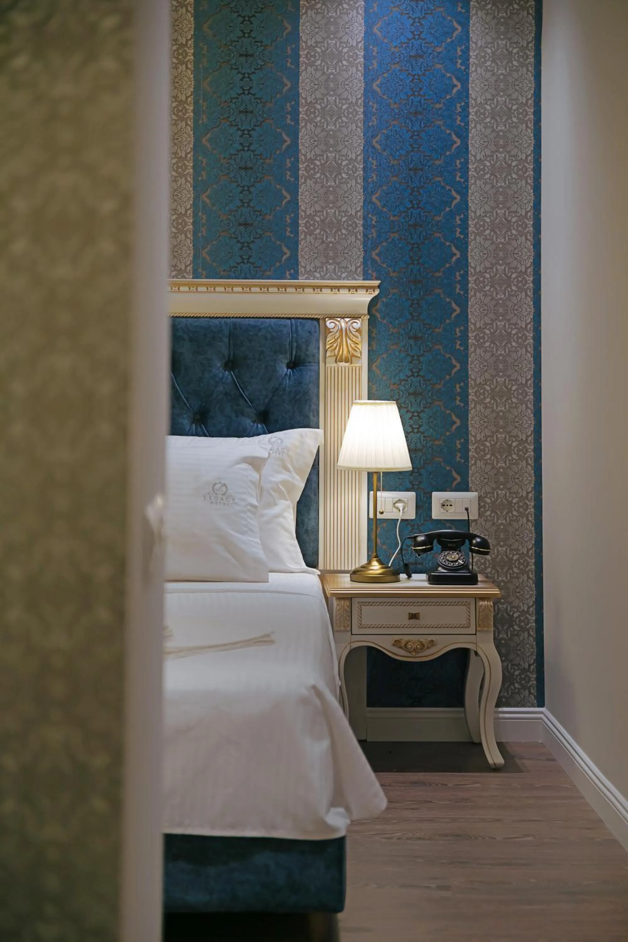 Bed in Legacy Boutique Hotel