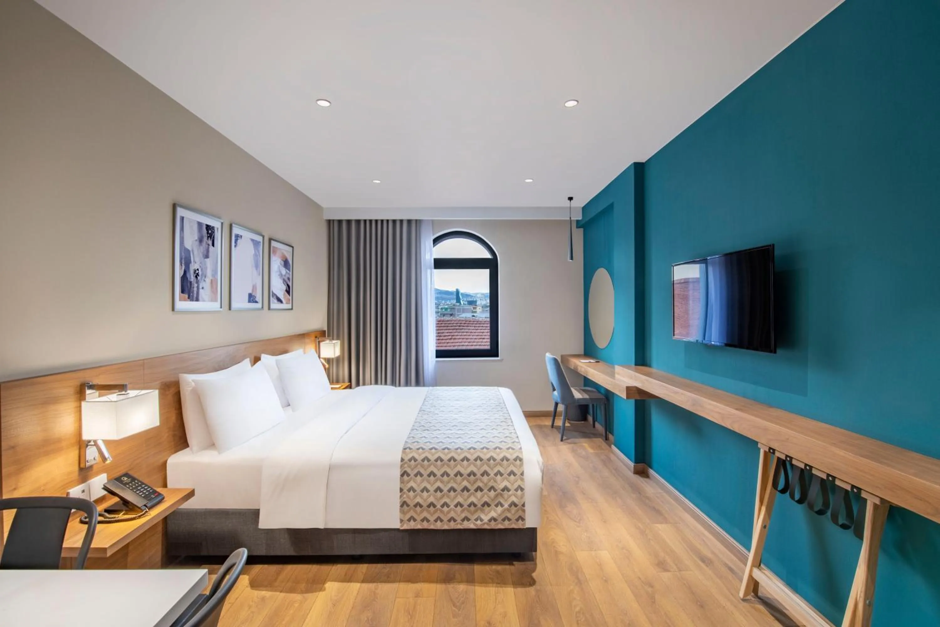 Bed in Clocks Hotel Tbilisi