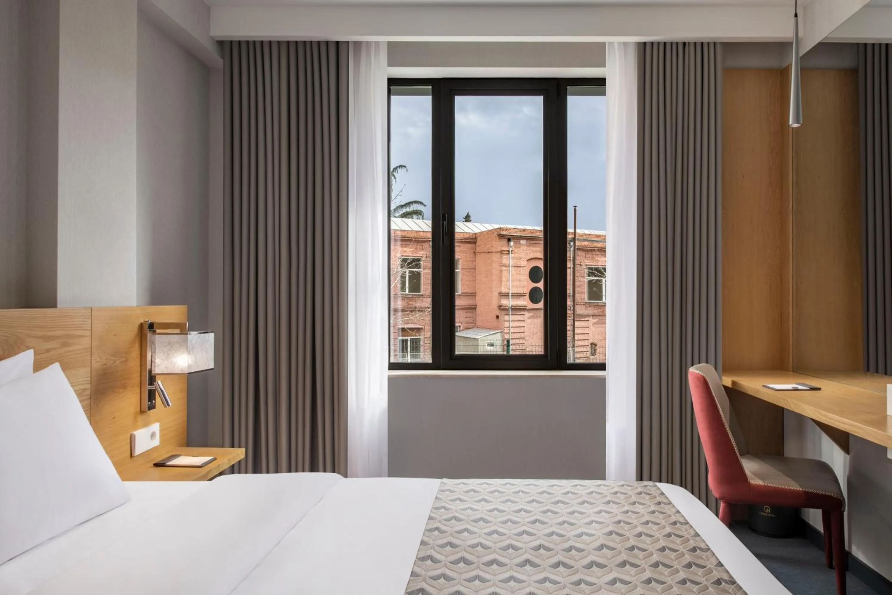 Bed in Clocks Hotel Tbilisi