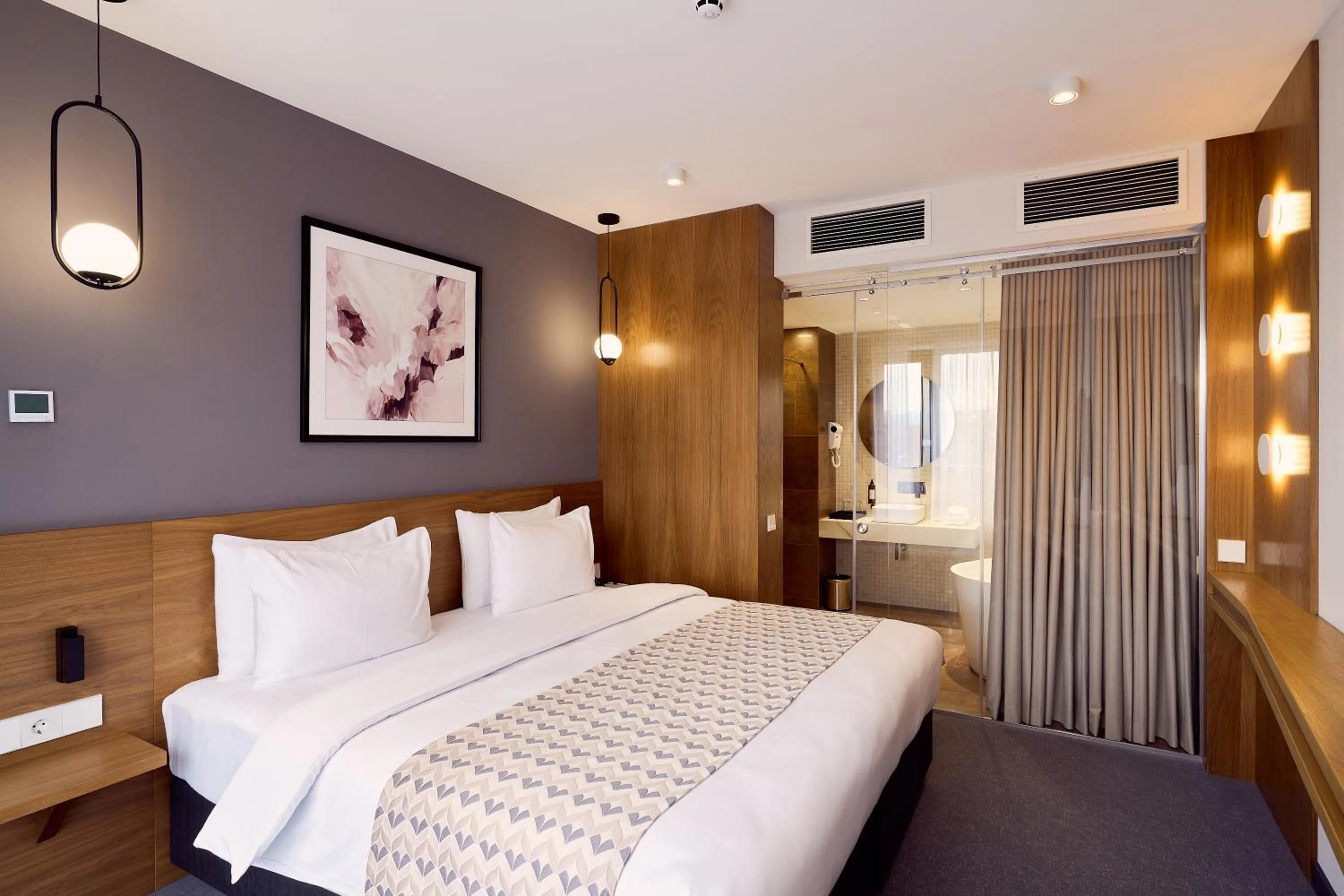 Bed in Clocks Hotel Tbilisi