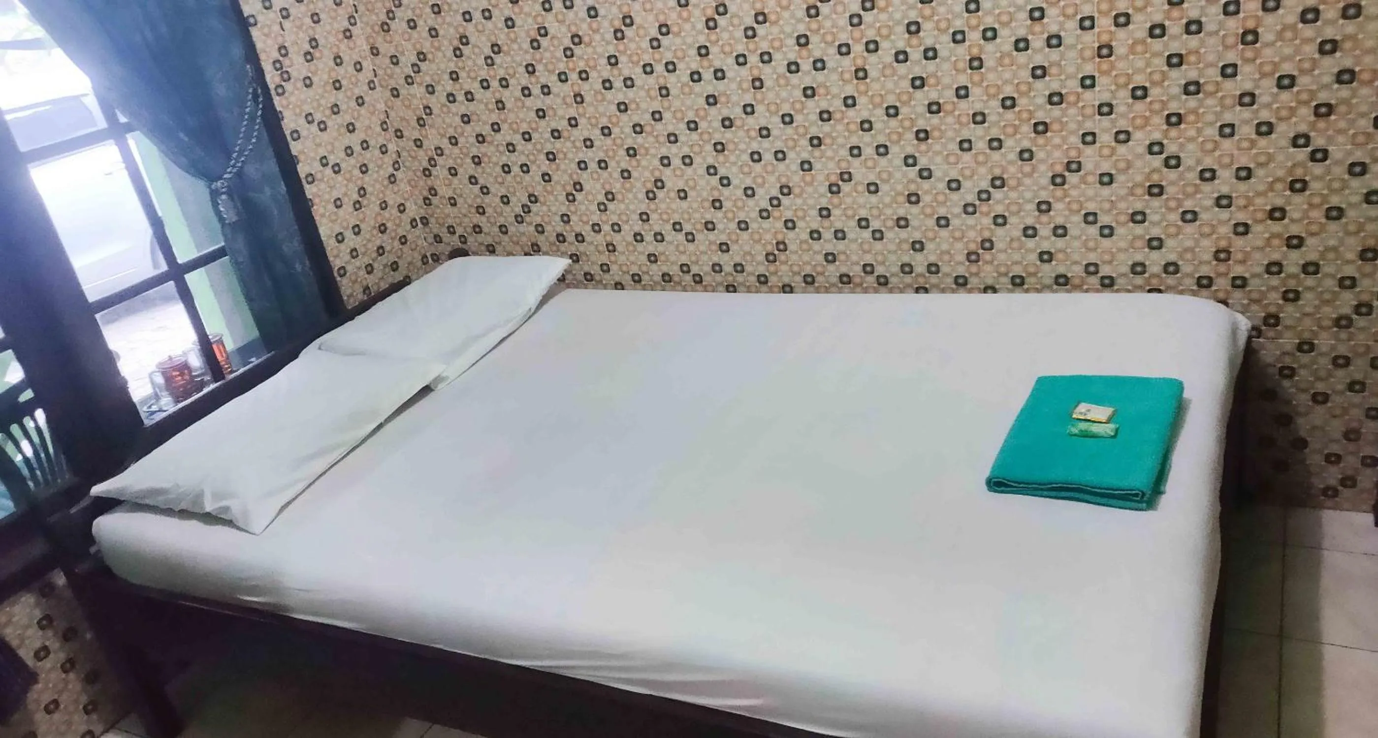 Bedroom, Bed in Bayu Murti Inn Kaliurang Yogyakarta RedPartner