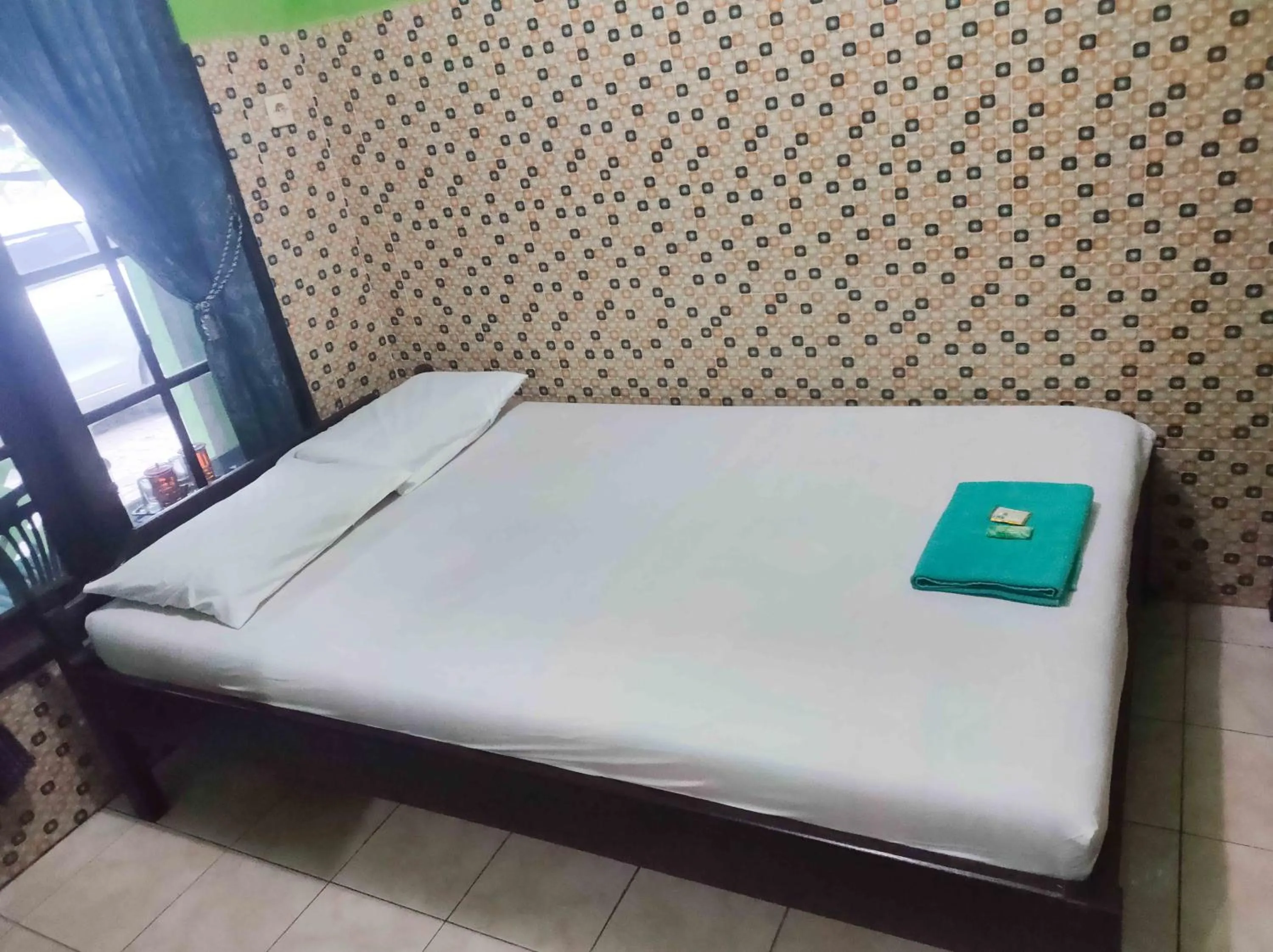 Bedroom, Bed in Bayu Murti Inn Kaliurang Yogyakarta RedPartner