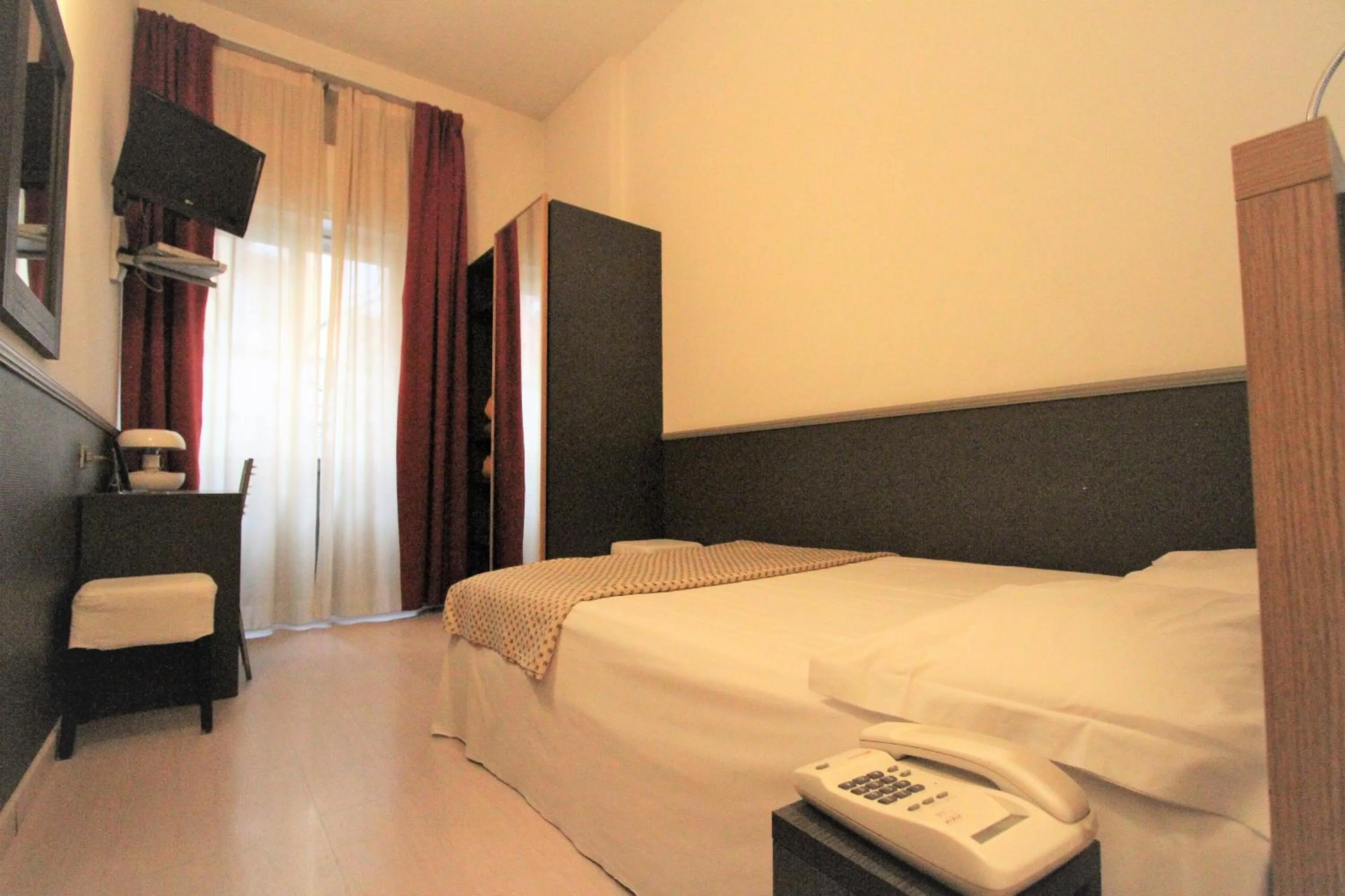 Bed in Hotel Corallo