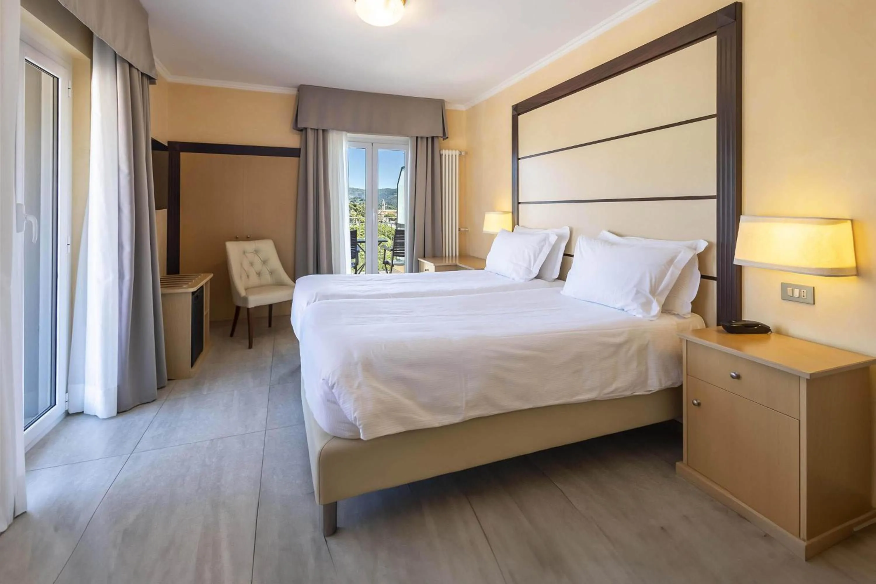 Photo of the whole room, Bed in B&B HOTEL Diano Marina Palace