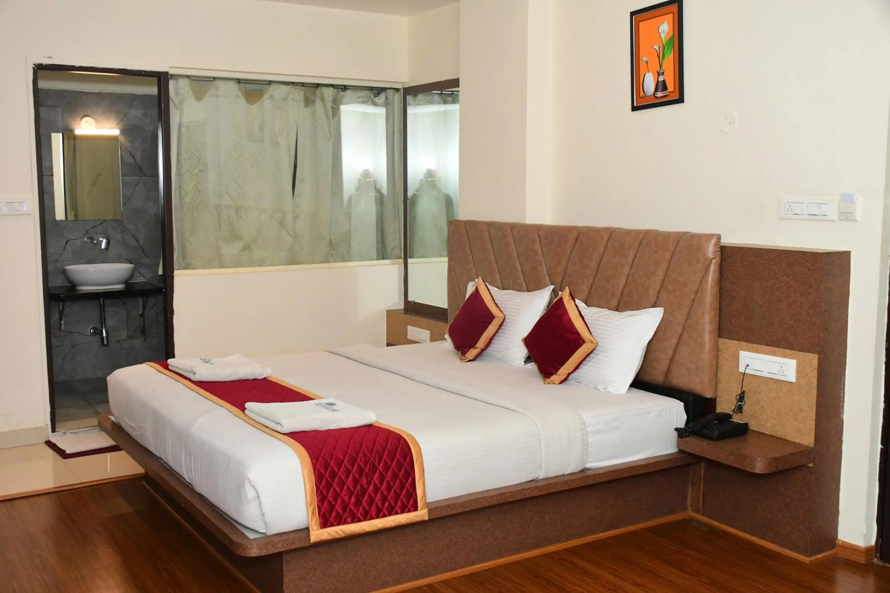 Bedroom, Bed in Sai Vihaar Inn & Suites