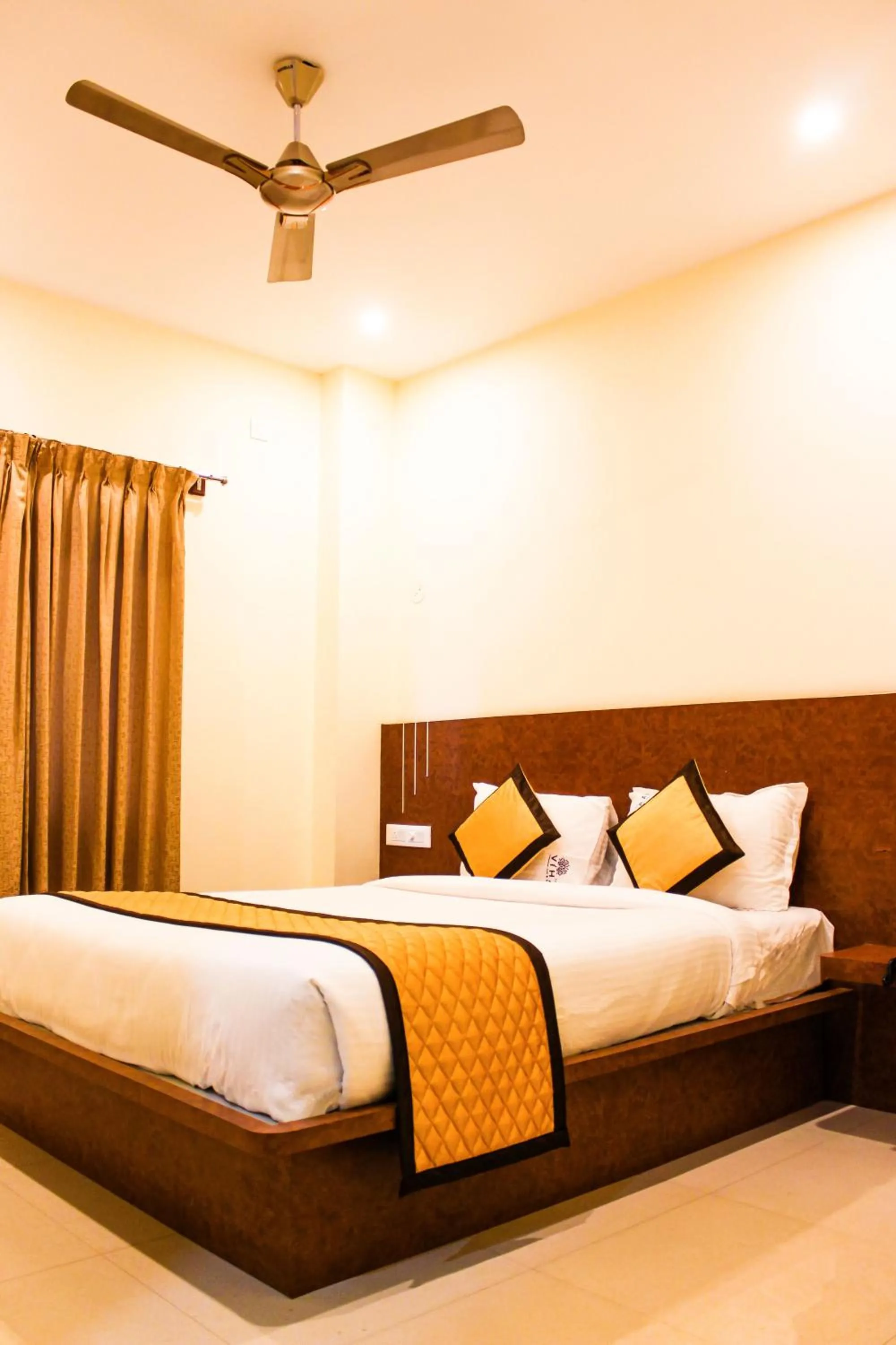 Photo of the whole room, Bed in Sai Vihaar Inn & Suites