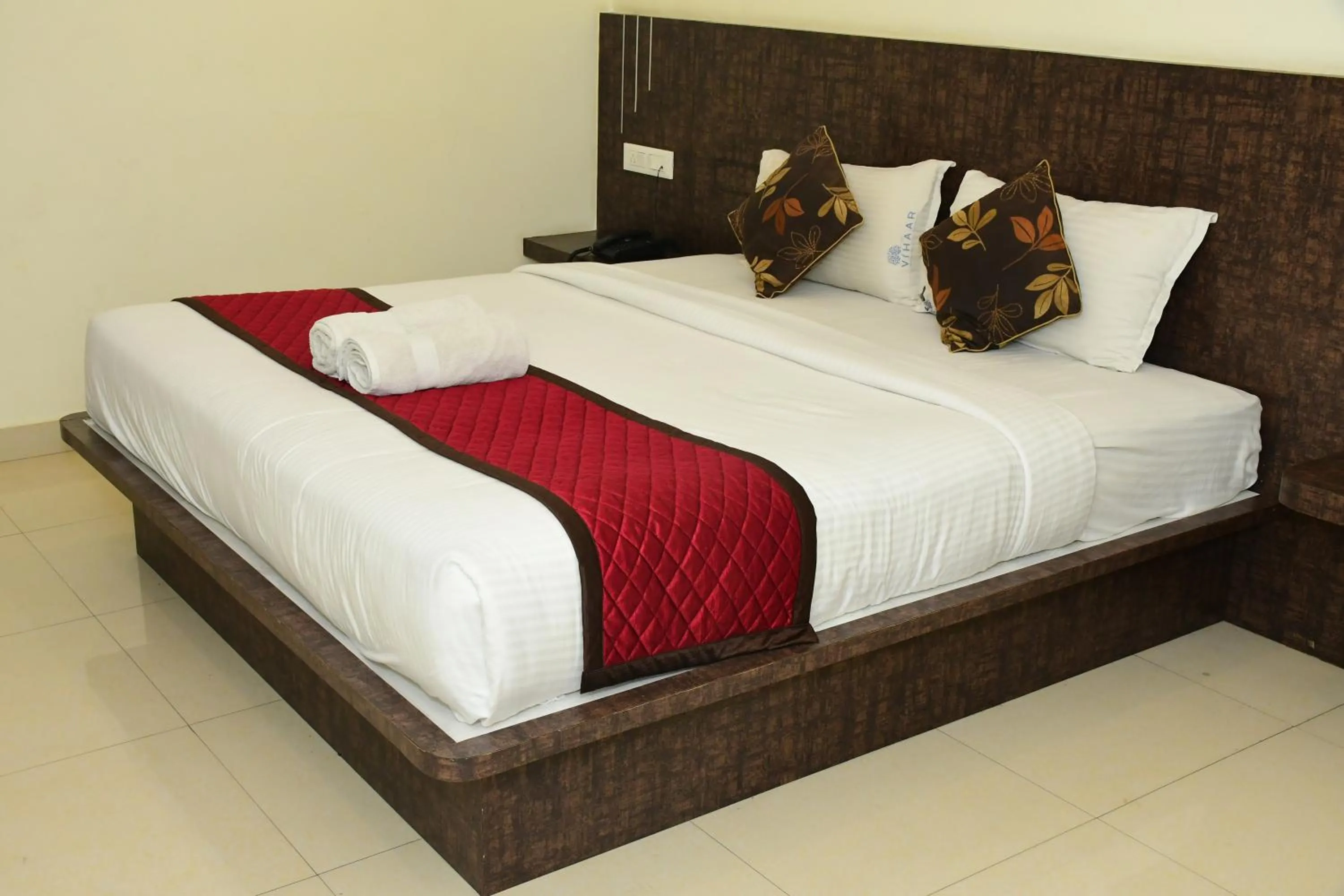 Bed in Sai Vihaar Inn & Suites