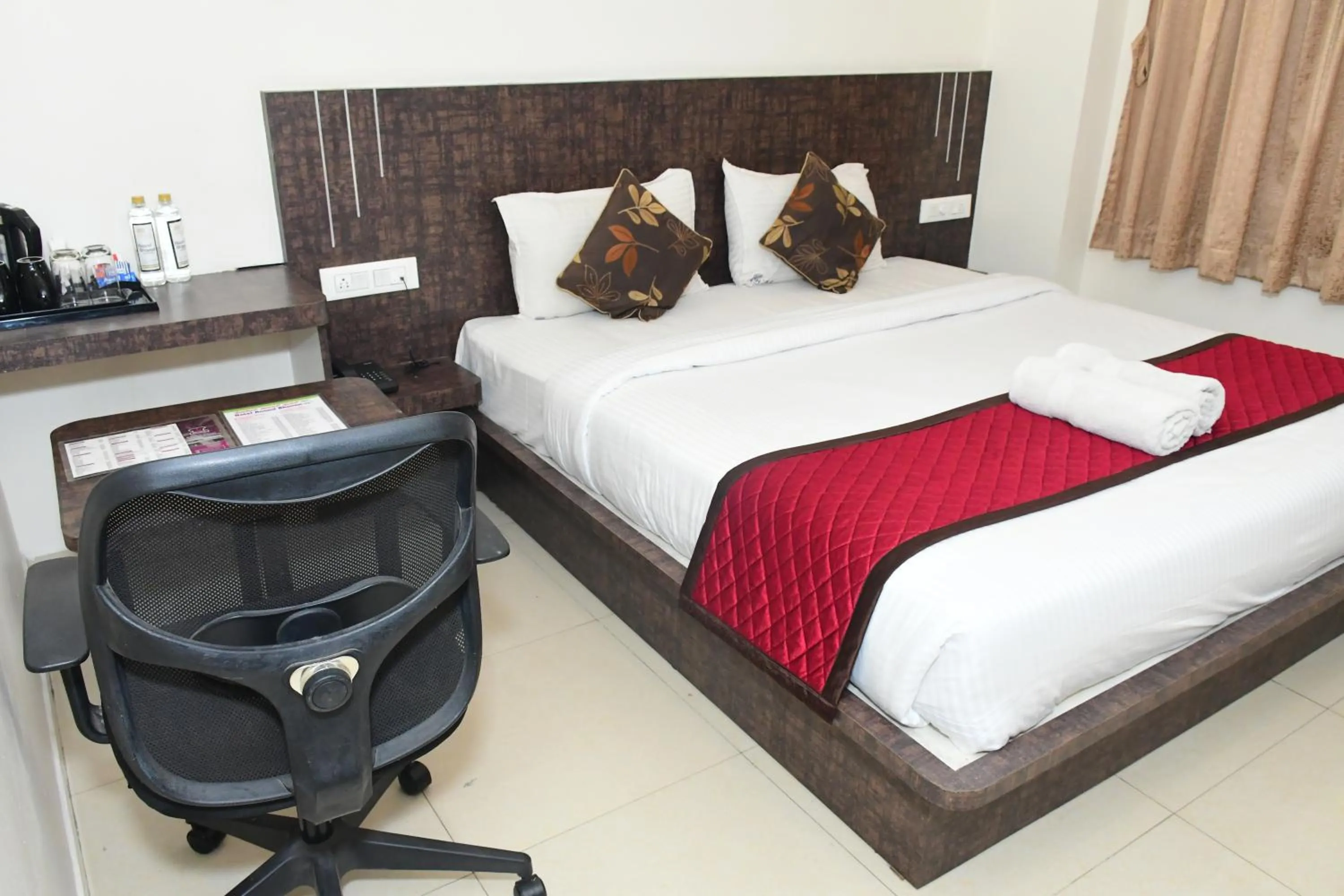Bed in Sai Vihaar Inn & Suites