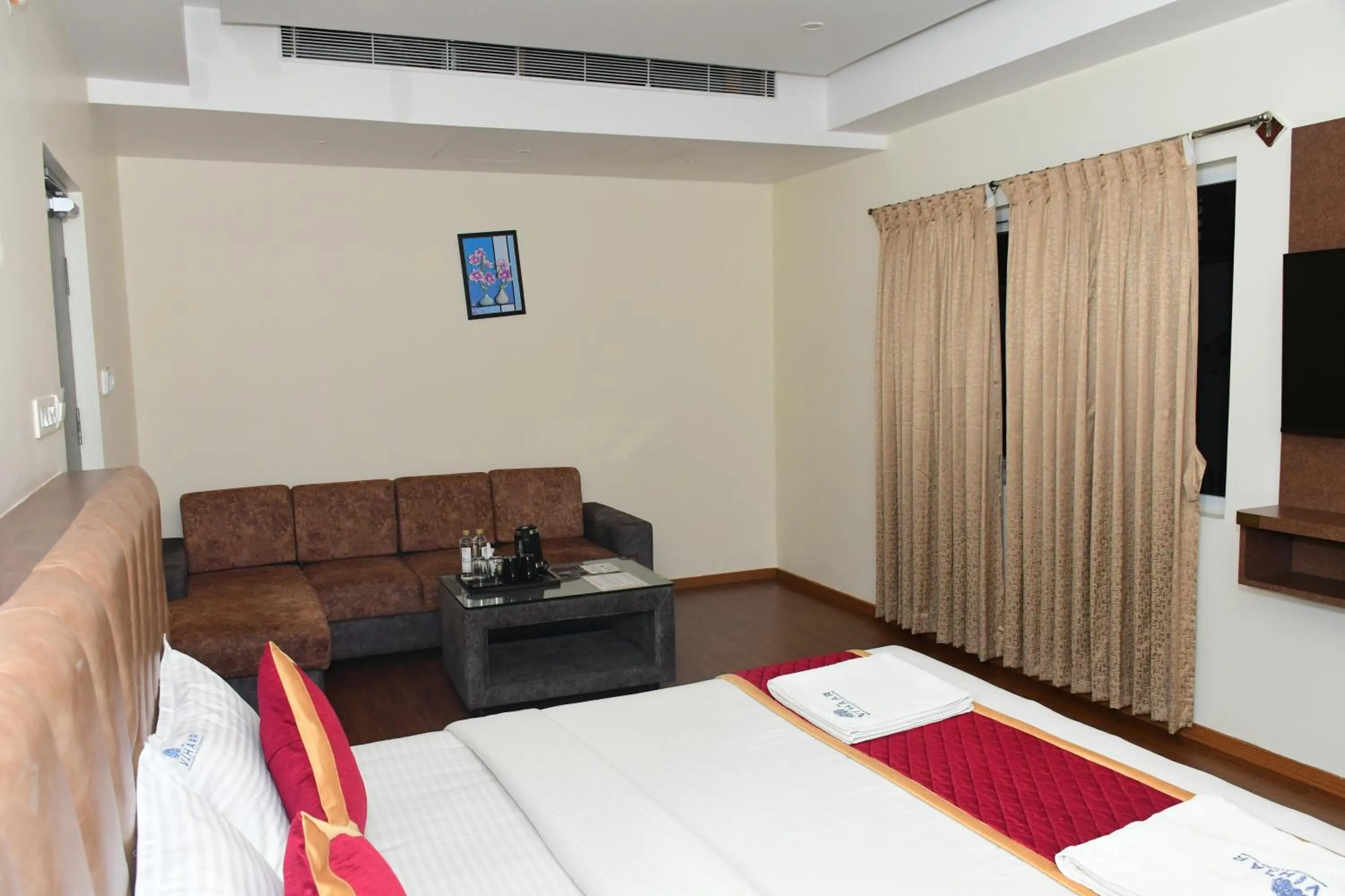 Photo of the whole room, Bed in Sai Vihaar Inn & Suites