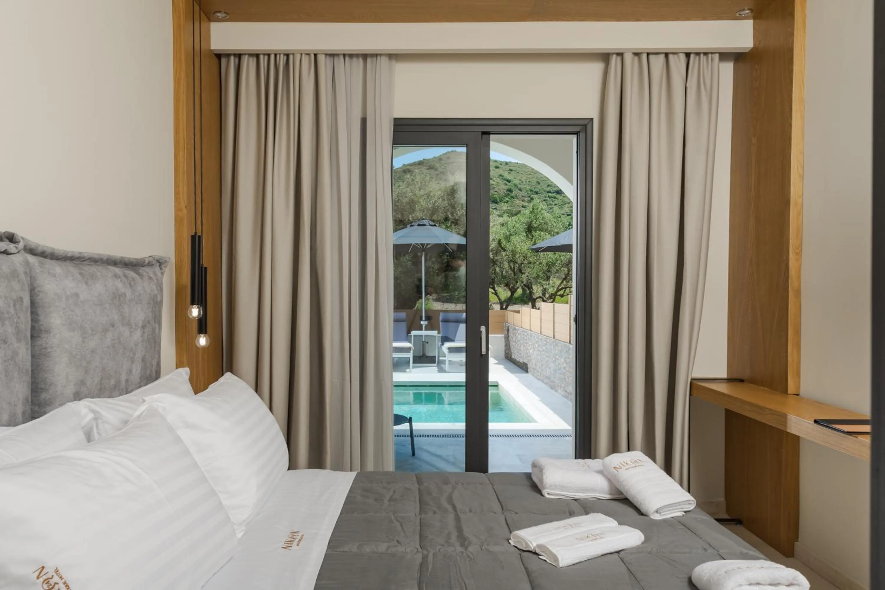 Pool view, Bed in Nikon Boutique Hotel