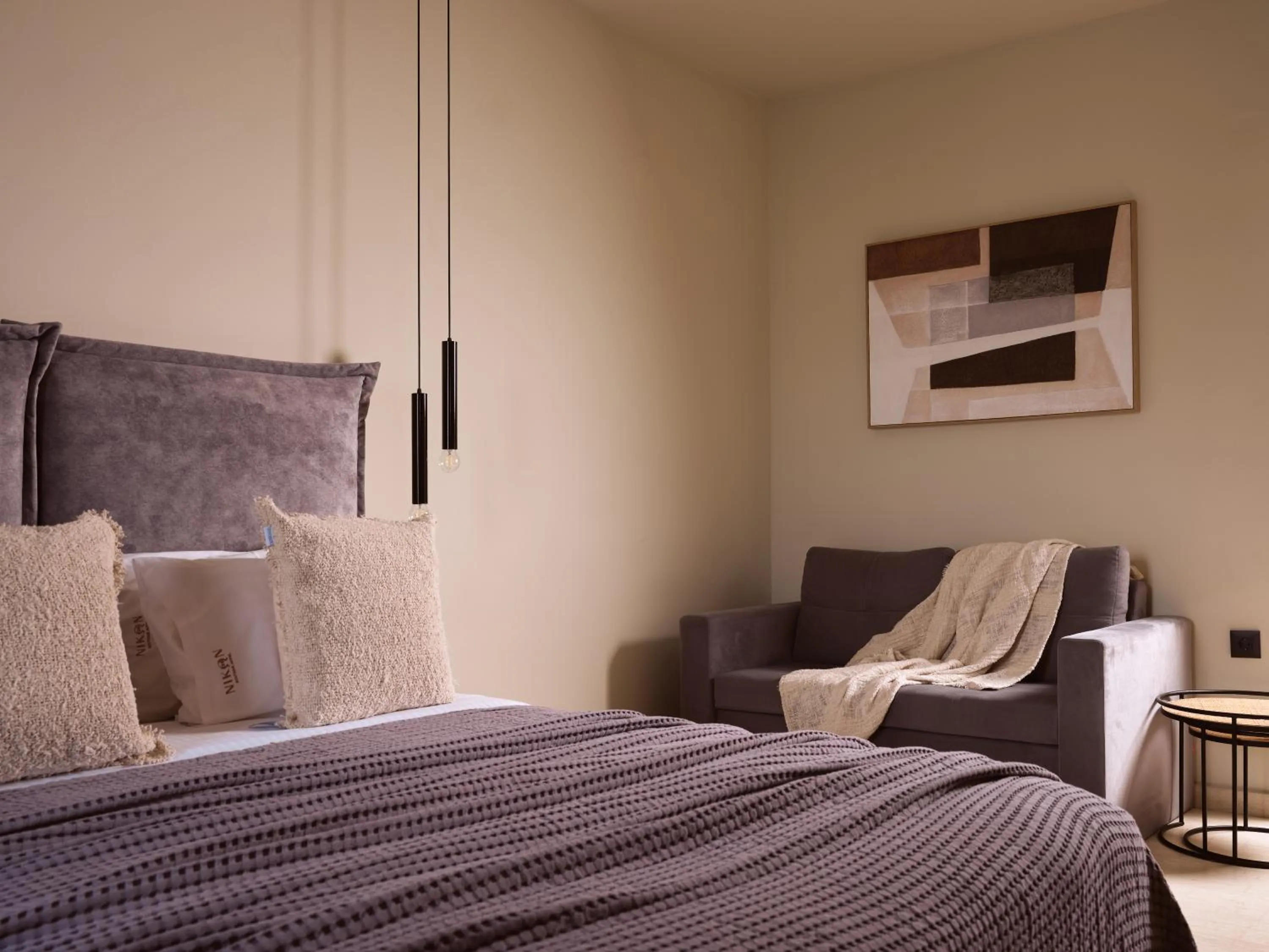 Bed in Nikon Boutique Hotel