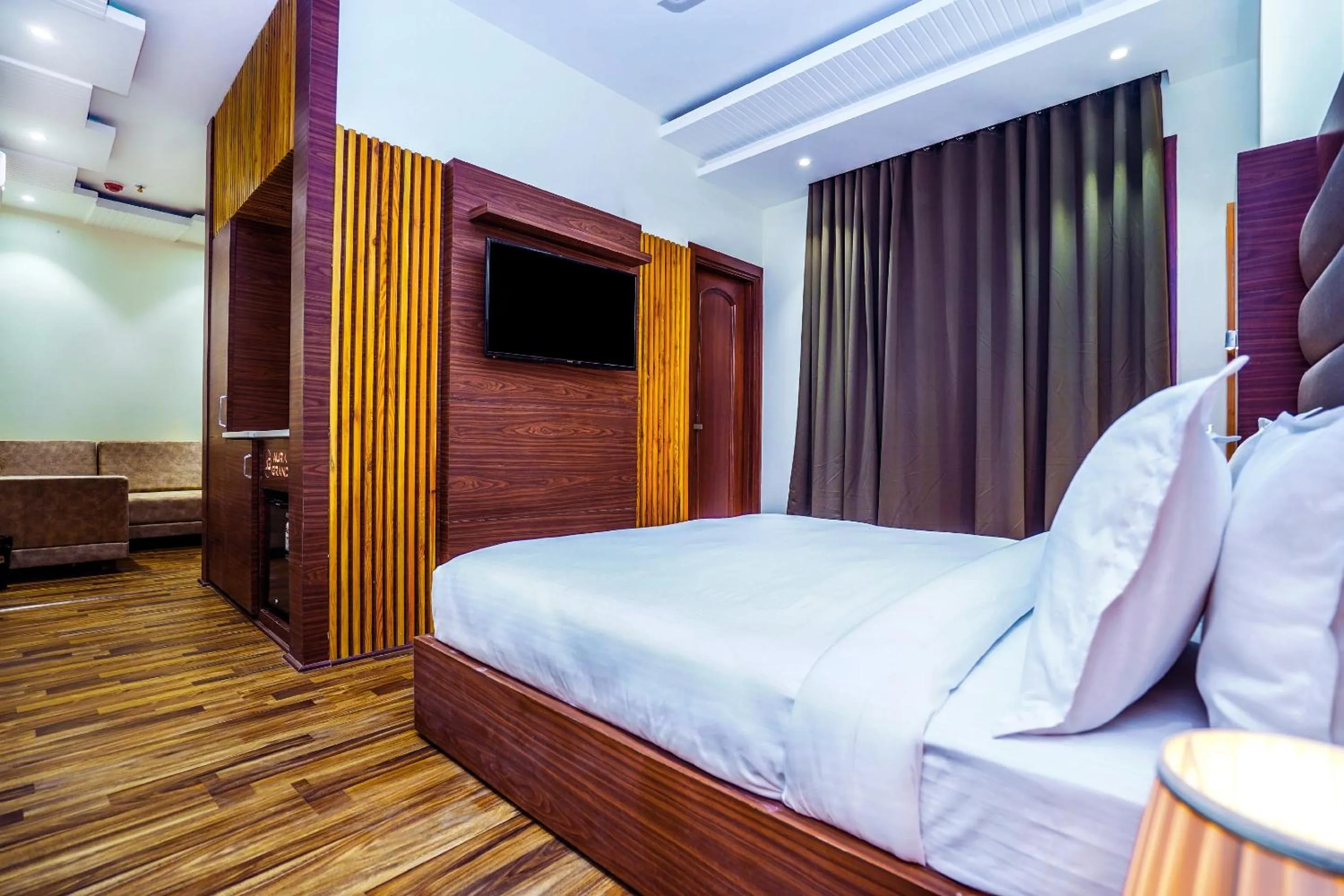 Photo of the whole room, Bed in Hotel Aura Grand By Levelup Hotels