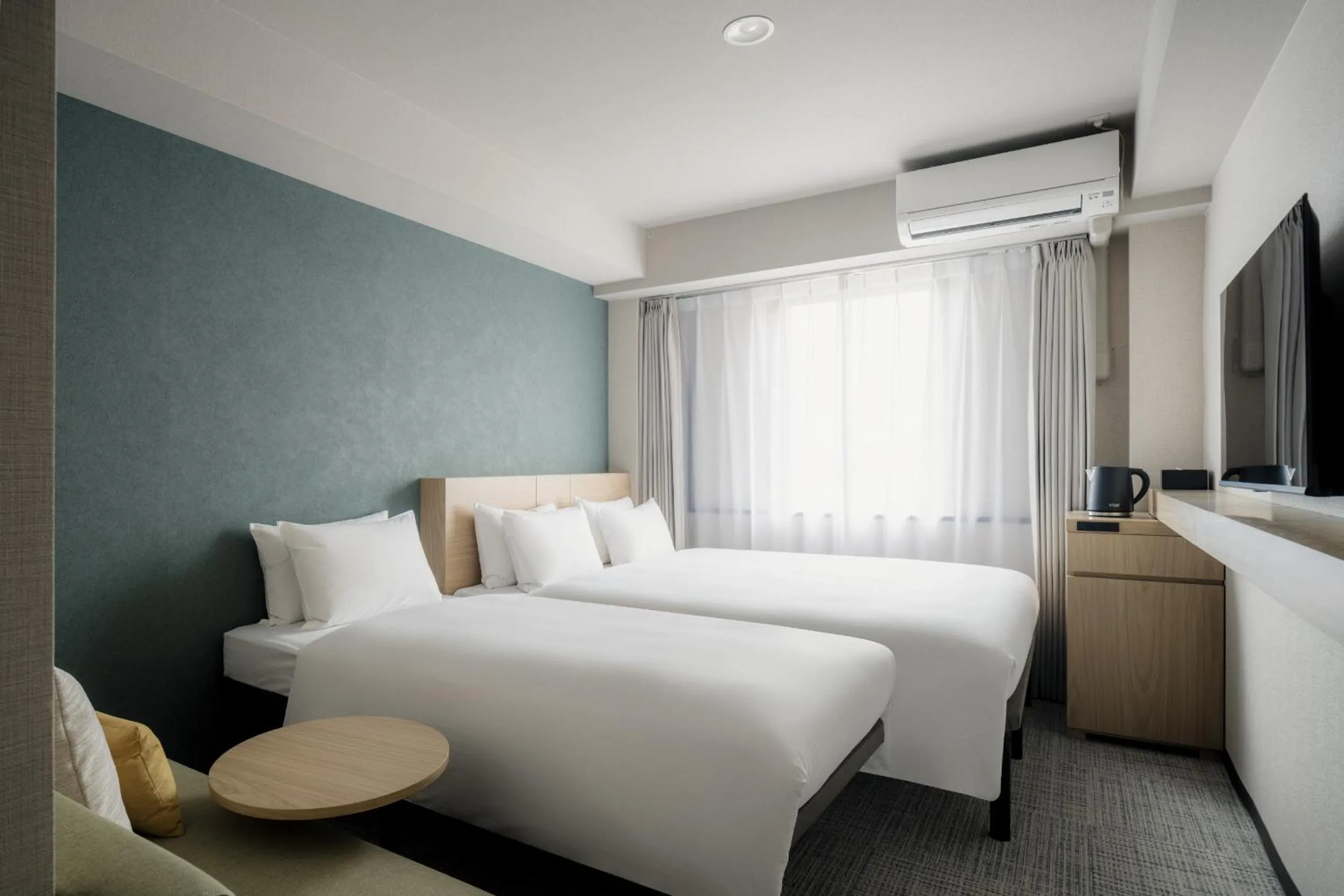 Photo of the whole room, Bed in Nest Hotel Ishigaki Maesato Beach