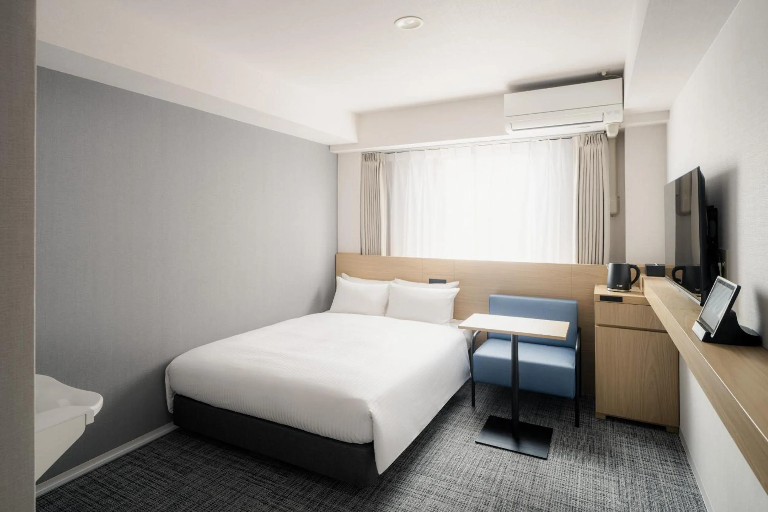 Photo of the whole room, Bed in Nest Hotel Ishigaki Maesato Beach