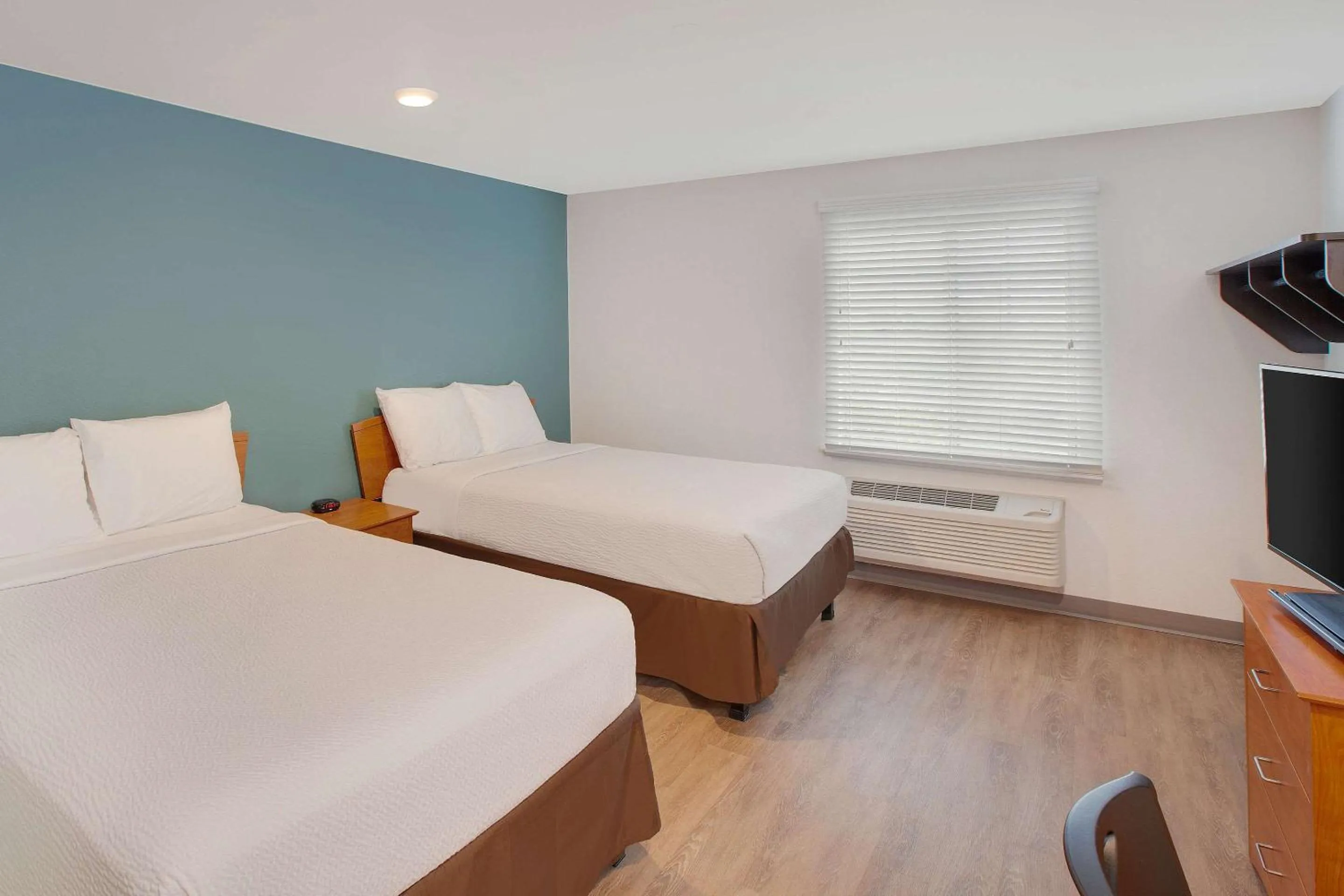 Photo of the whole room, Bed in WoodSpring Suites Harlingen