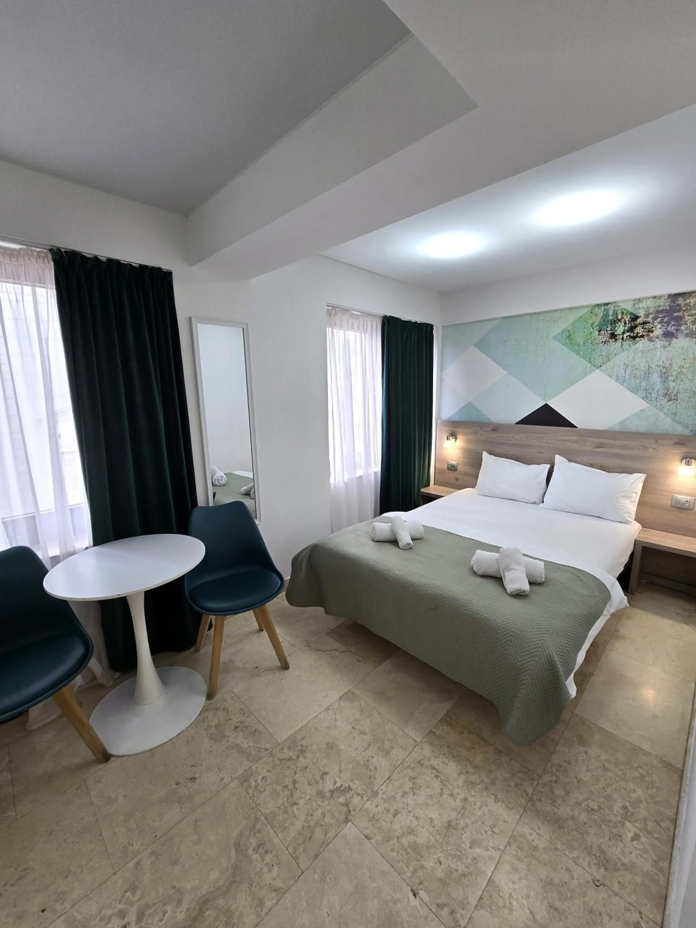 Bed in Dacia Residence Apartments