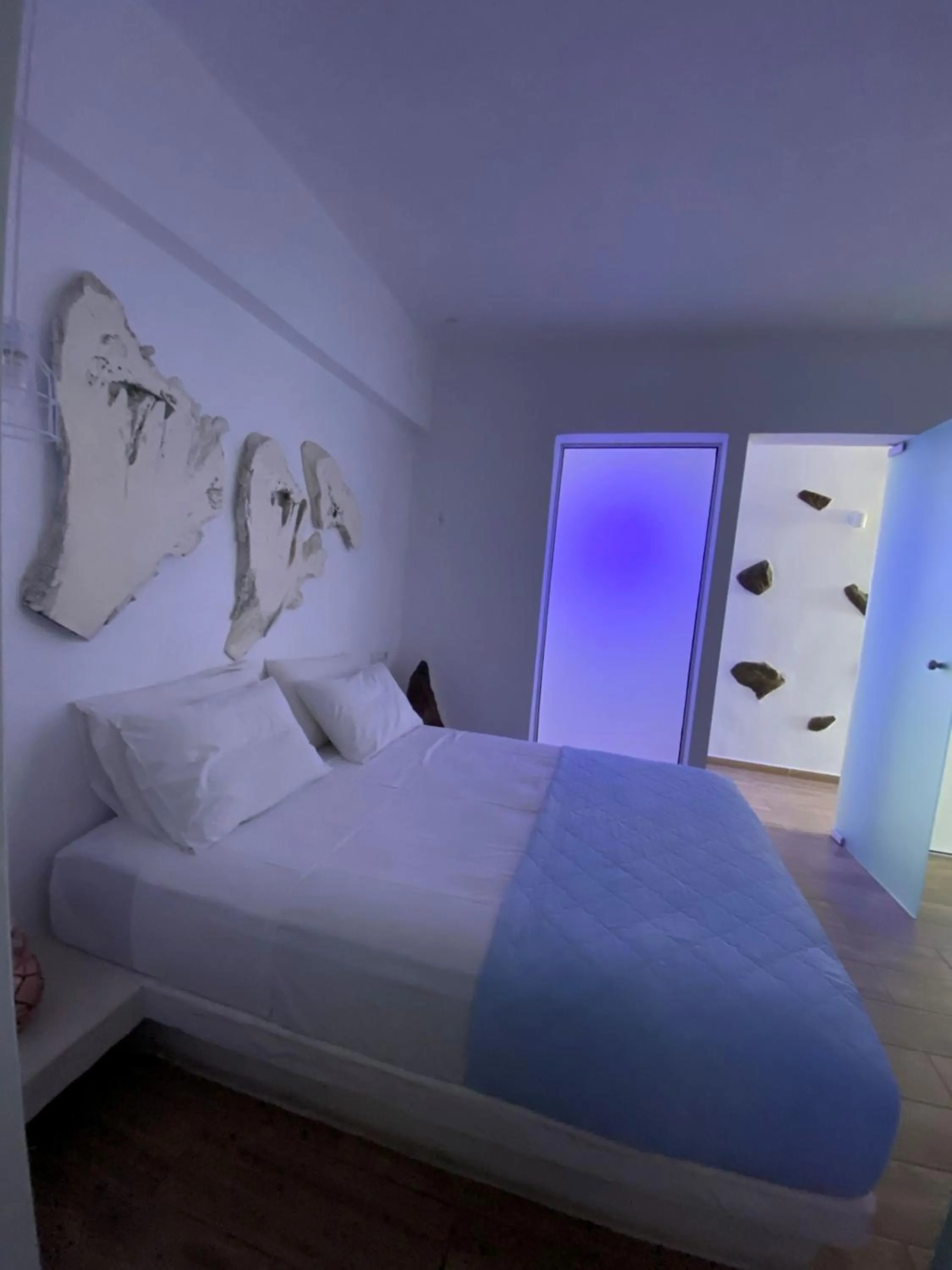 Bed in Kouros Home & Suites