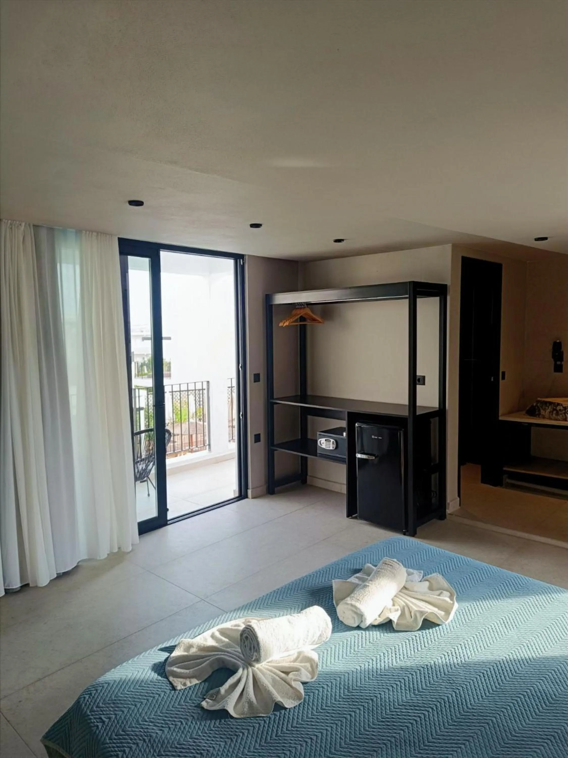 Bed in Kouros Home & Suites