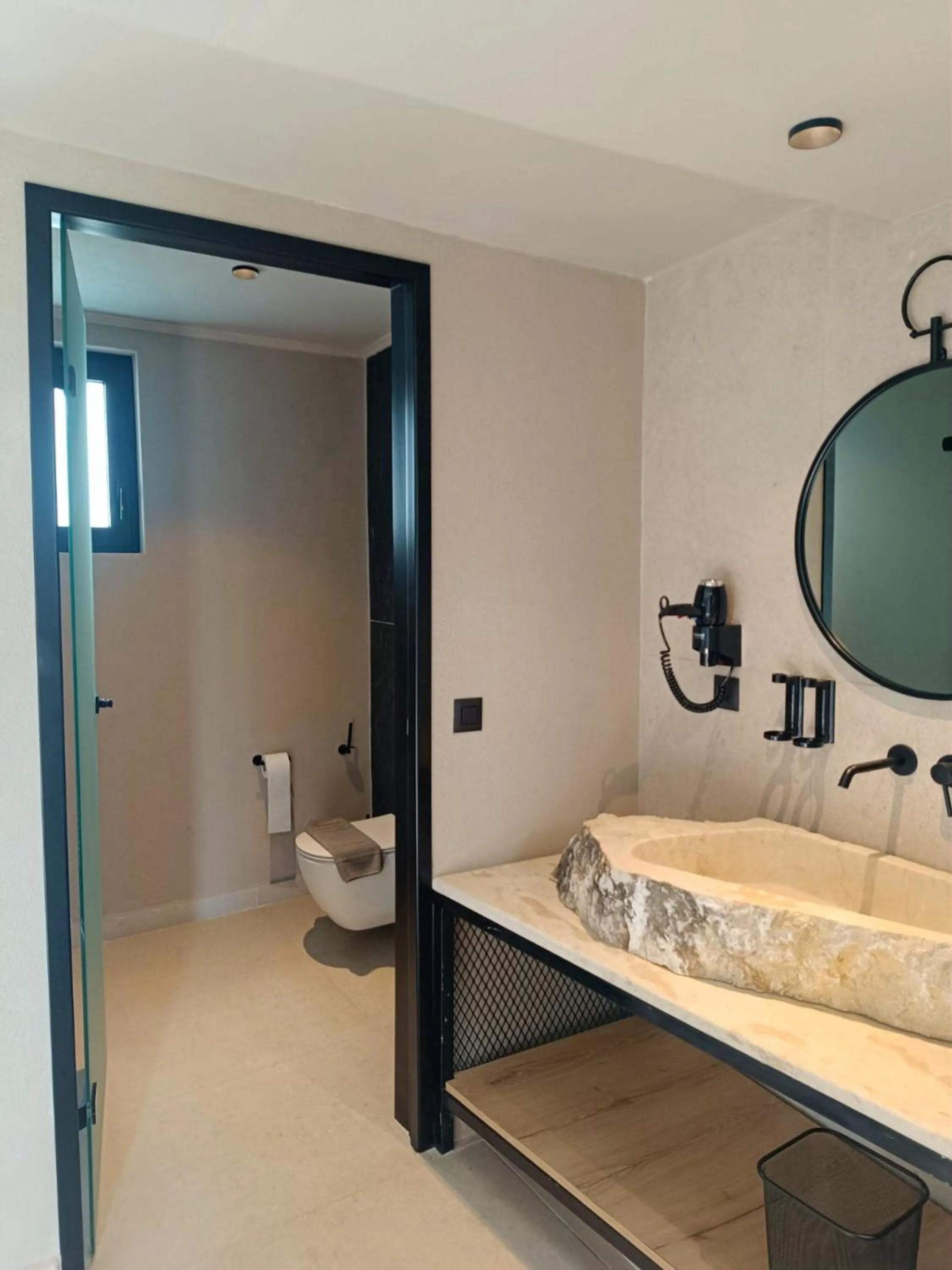 Toilet in Kouros Home & Suites