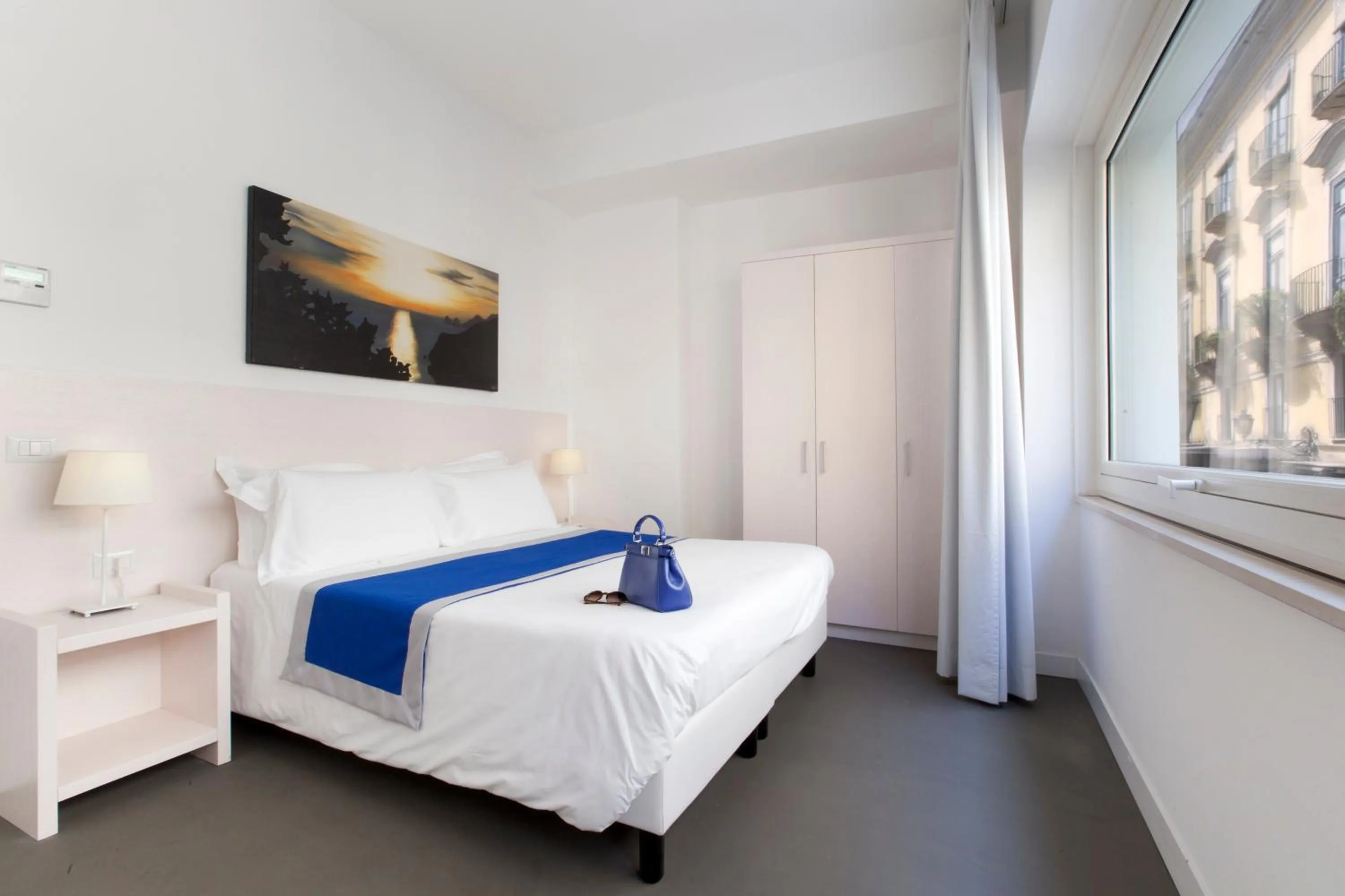 Bed in Hotel Tasso Suites & Spa