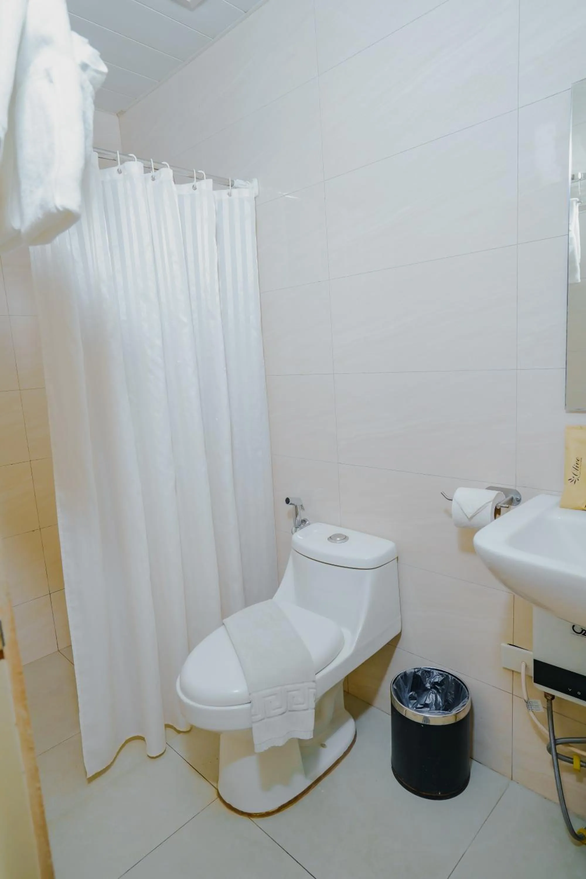 Bathroom in Olive Town Center and Hotel