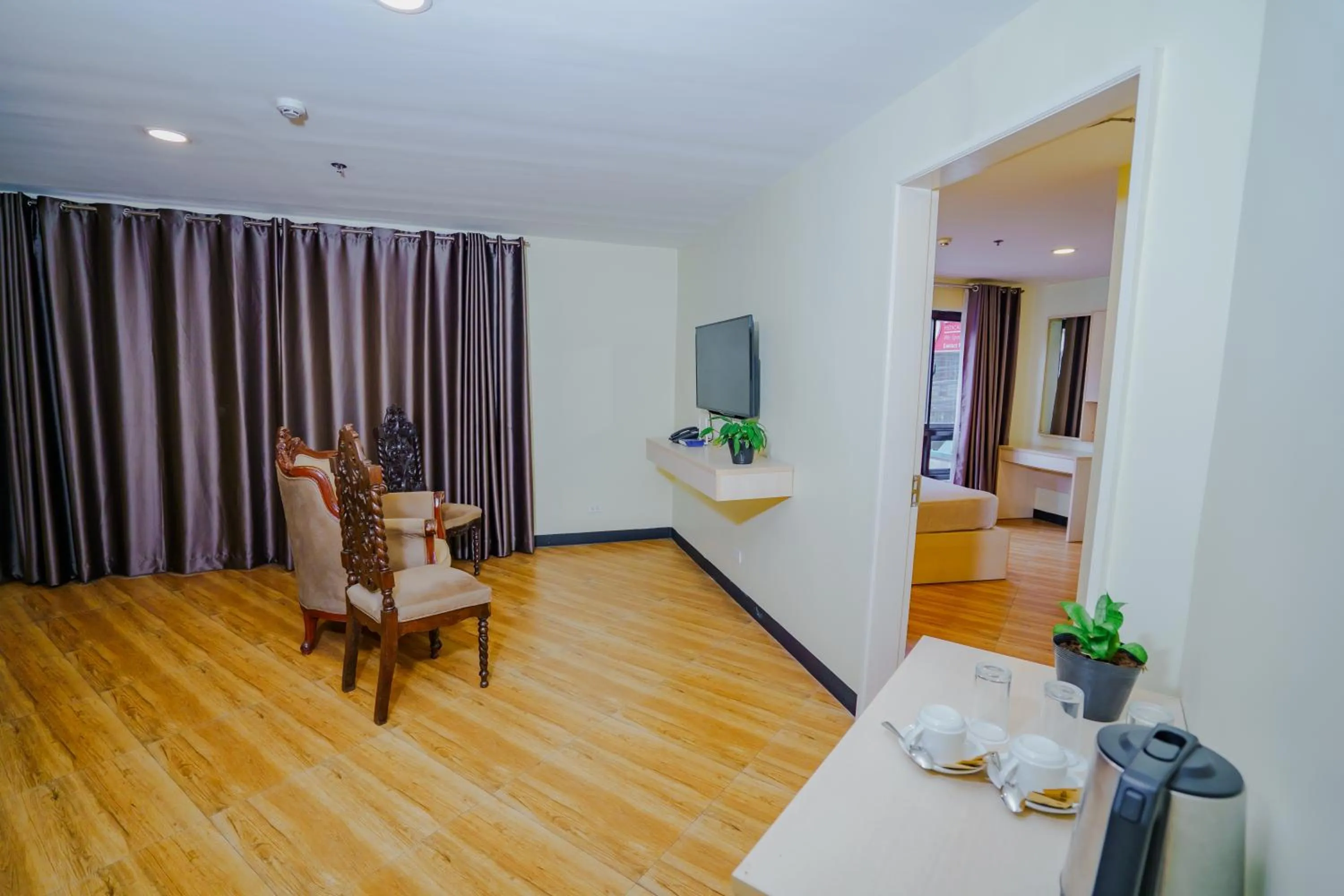 Living room, Bed in Olive Town Center and Hotel