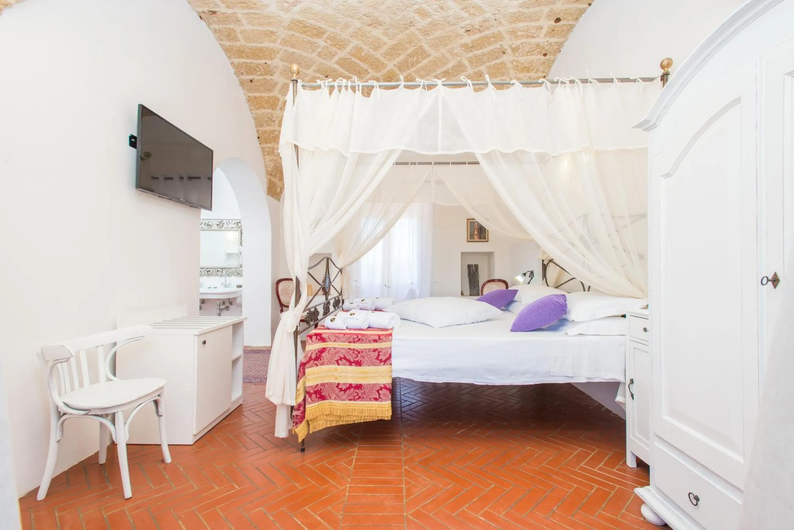 Bed in RELAIS MASSERIA CASINA DEI CARI