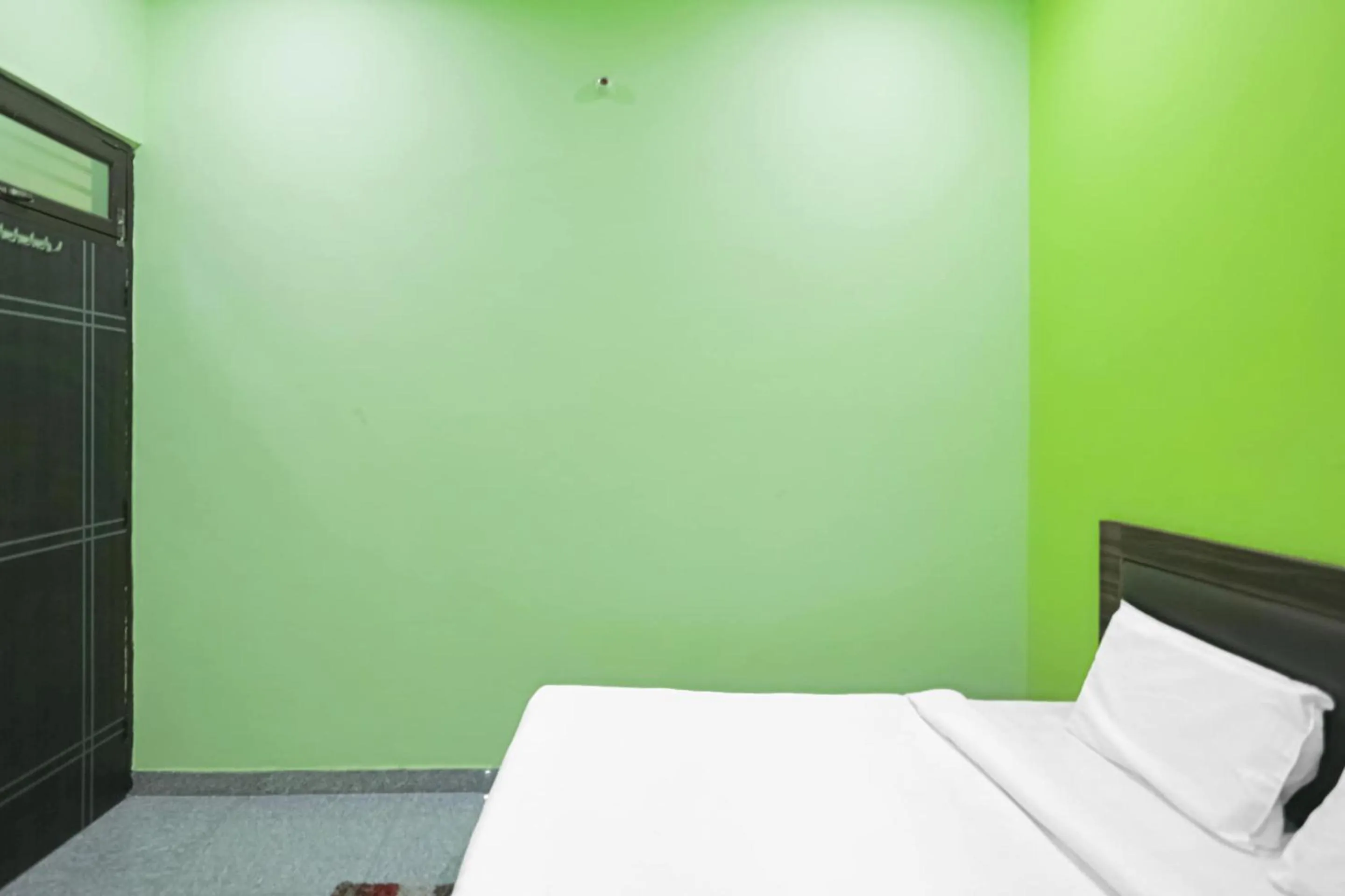 Bedroom in Capital O A-one