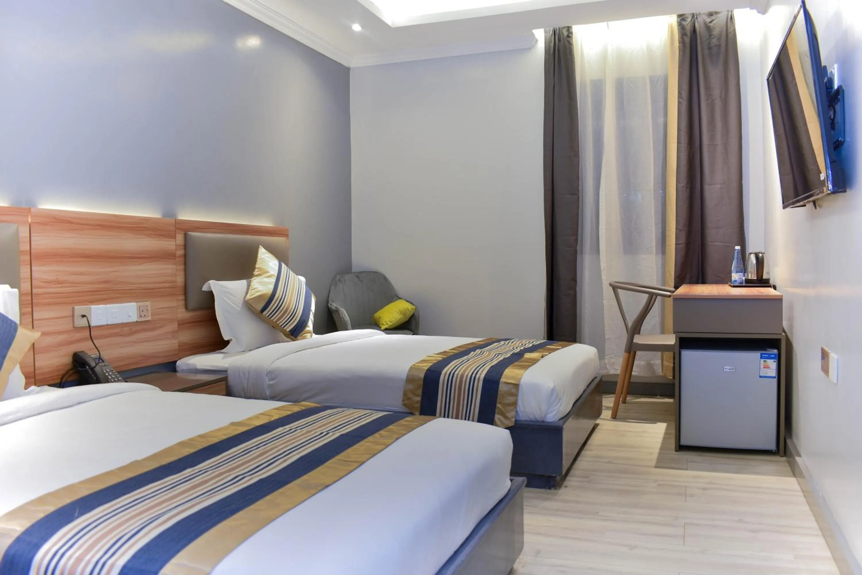 Photo of the whole room, Bed in Raha Suites - Westlands