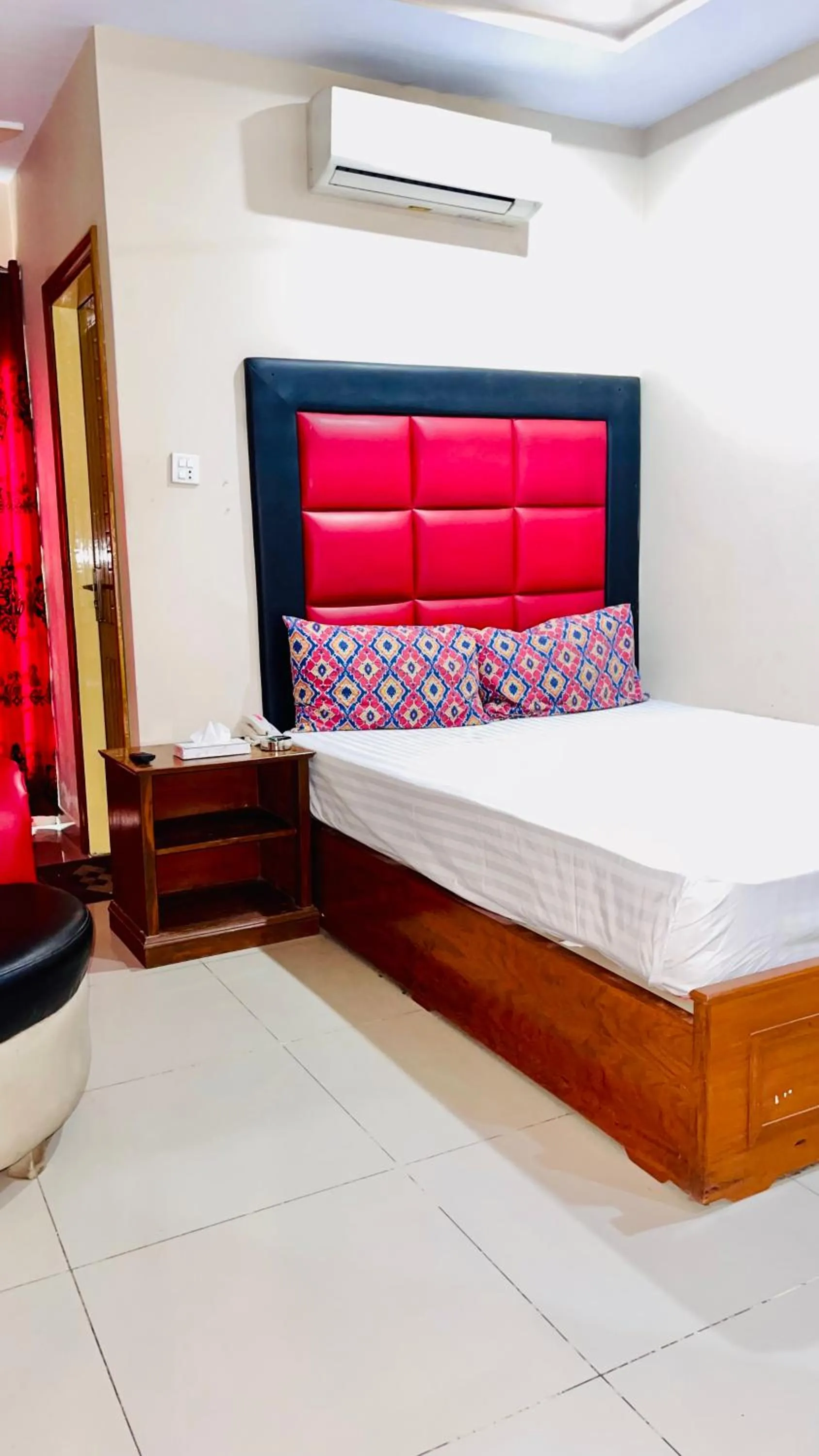 Bed in Plaza Inn Hotel