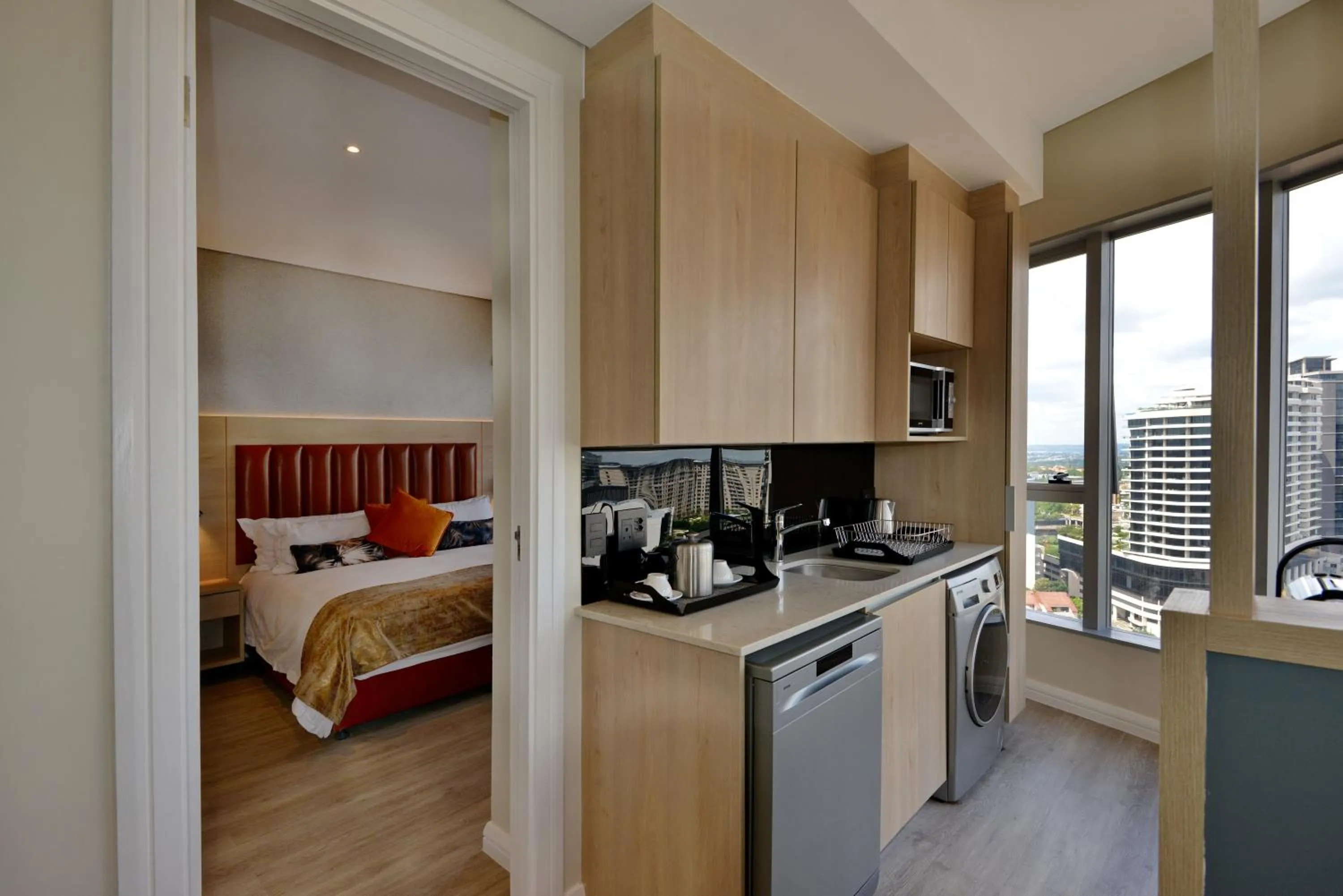 kitchen, Bed in @Sandton Hotel