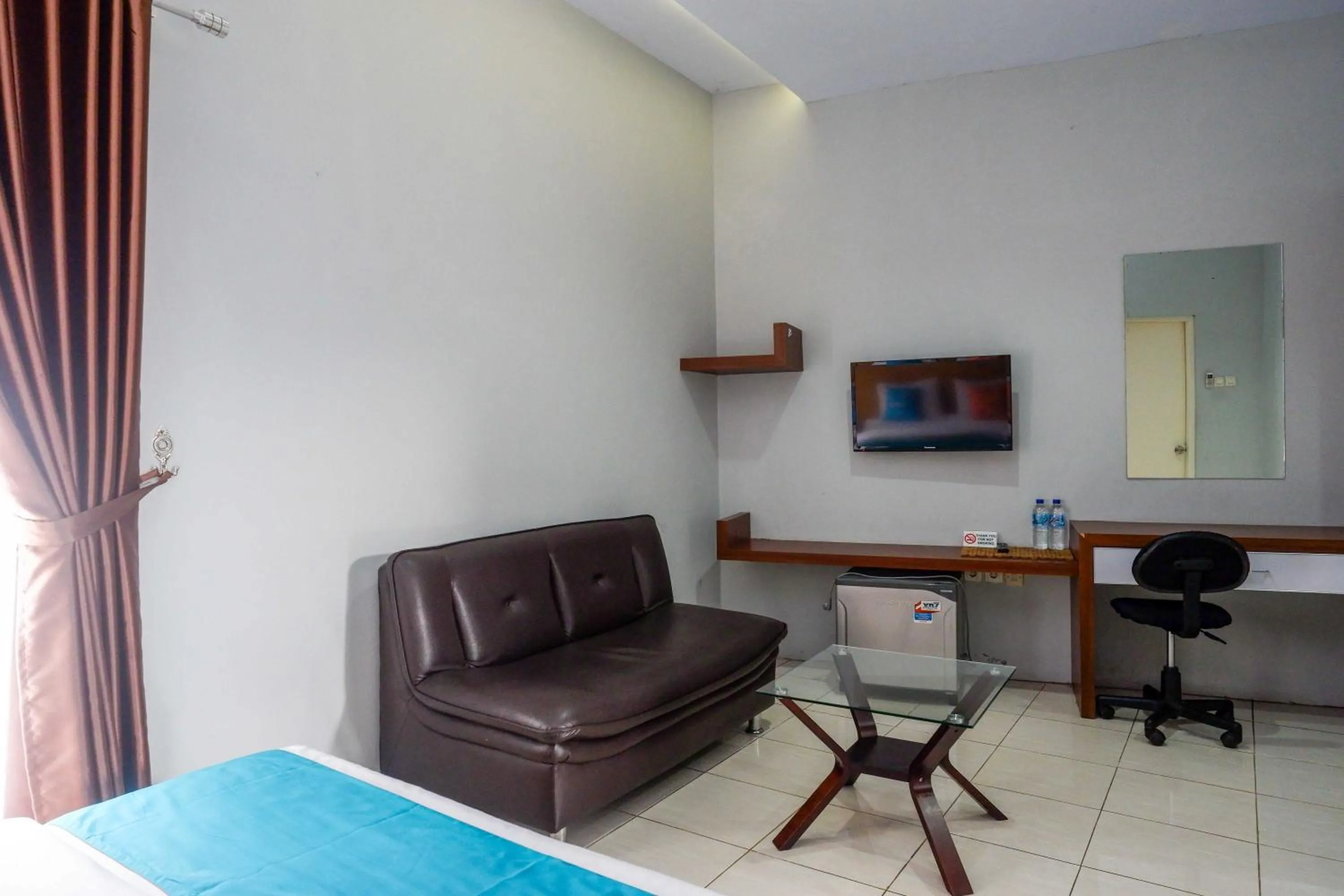 Bedroom in Sans Hotel Absari Yogyakarta