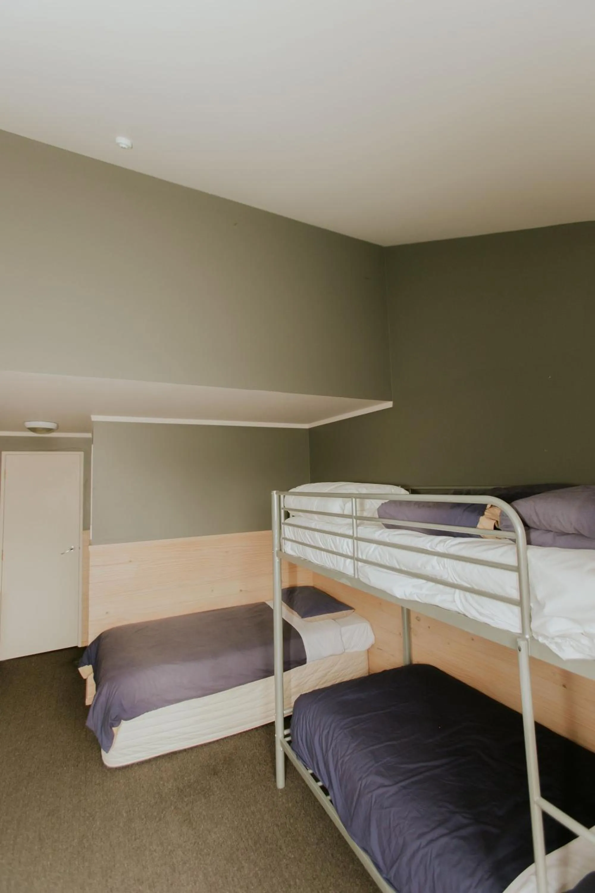 Bedroom, Bed in Waitomo Village Chalets home of Kiwipaka