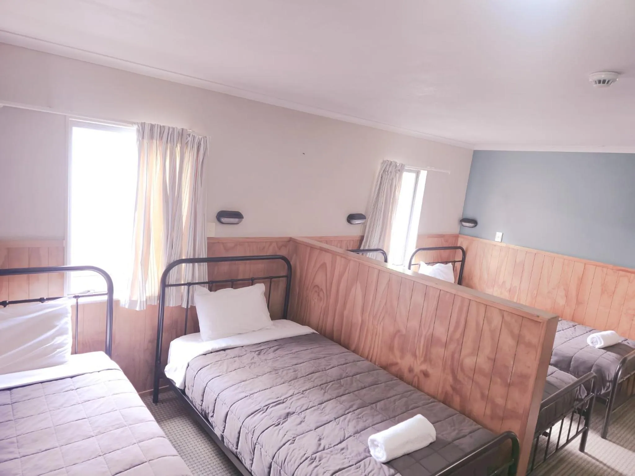 Bed in Waitomo Village Chalets home of Kiwipaka