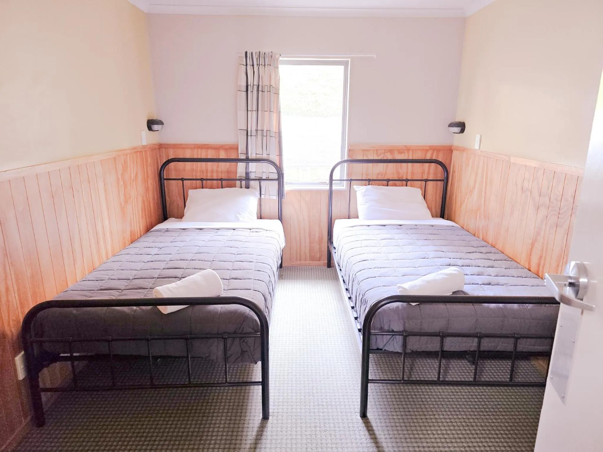 Bed in Waitomo Village Chalets home of Kiwipaka