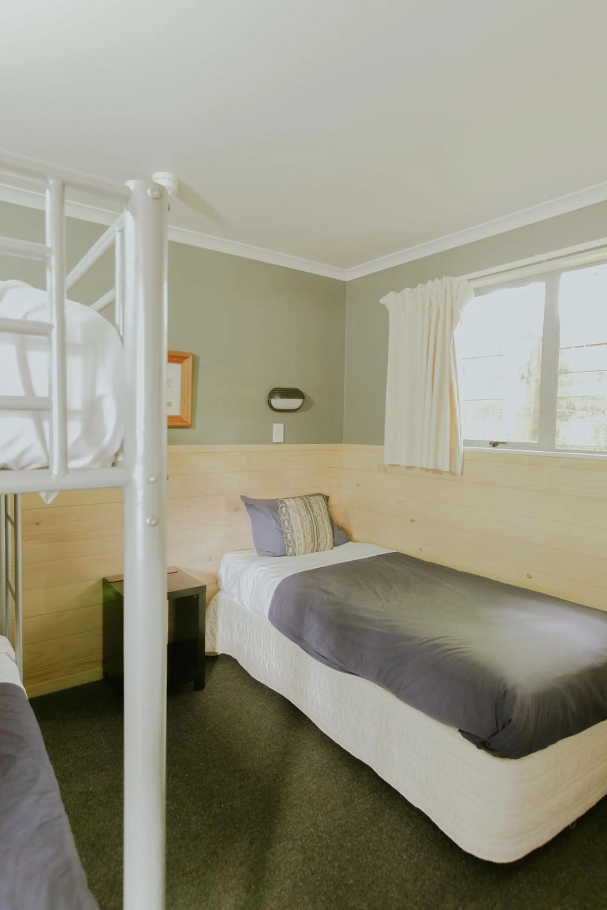 Bedroom, Bed in Waitomo Village Chalets home of Kiwipaka