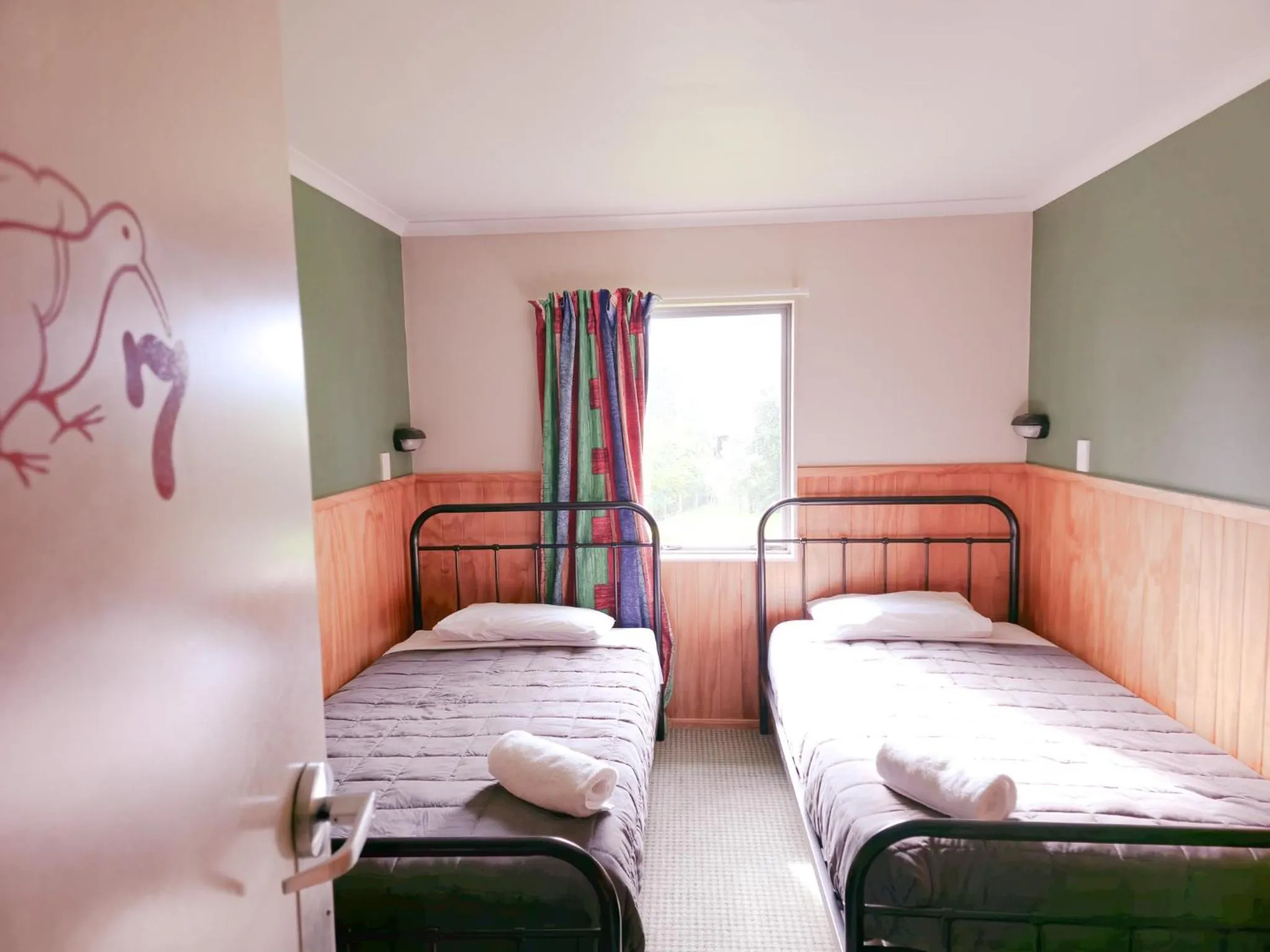 Bed in Waitomo Village Chalets home of Kiwipaka