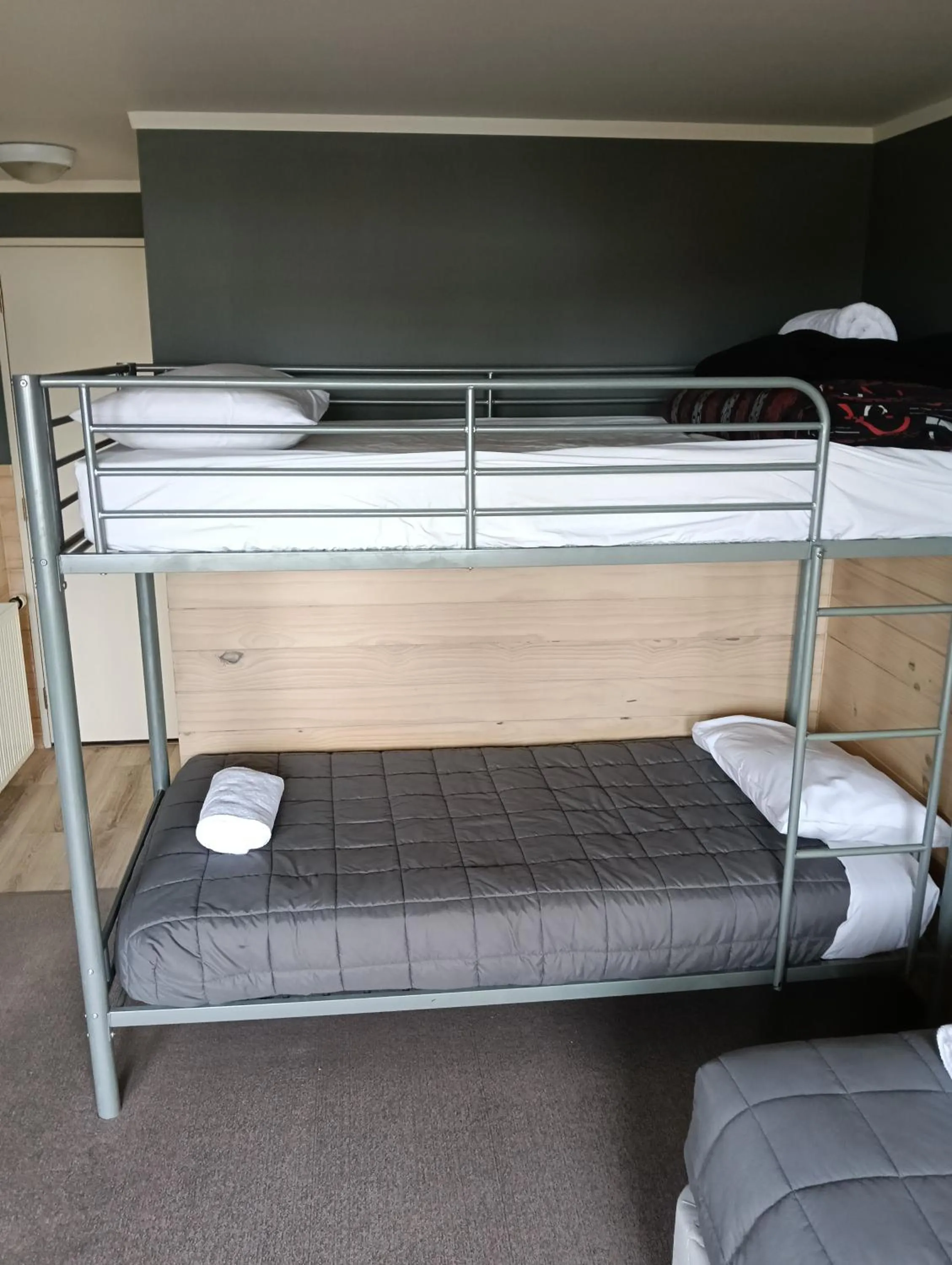 Bed in Waitomo Village Chalets home of Kiwipaka