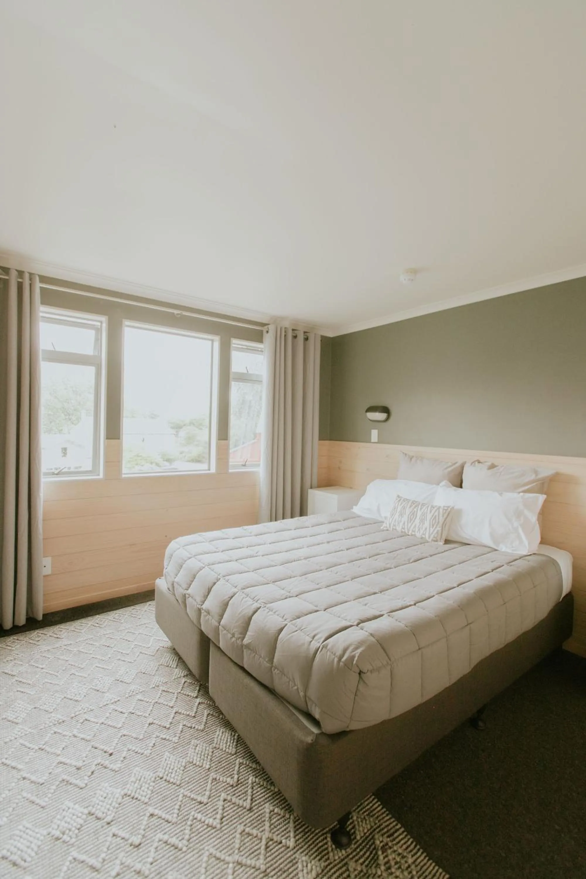 Bedroom, Bed in Waitomo Village Chalets home of Kiwipaka