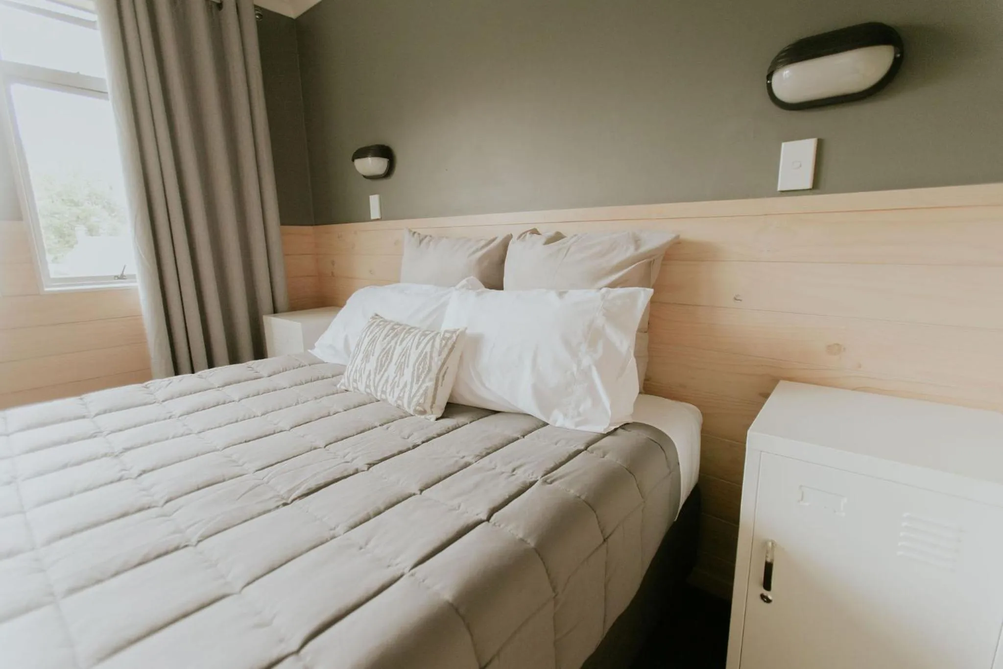 Bedroom, Bed in Waitomo Village Chalets home of Kiwipaka