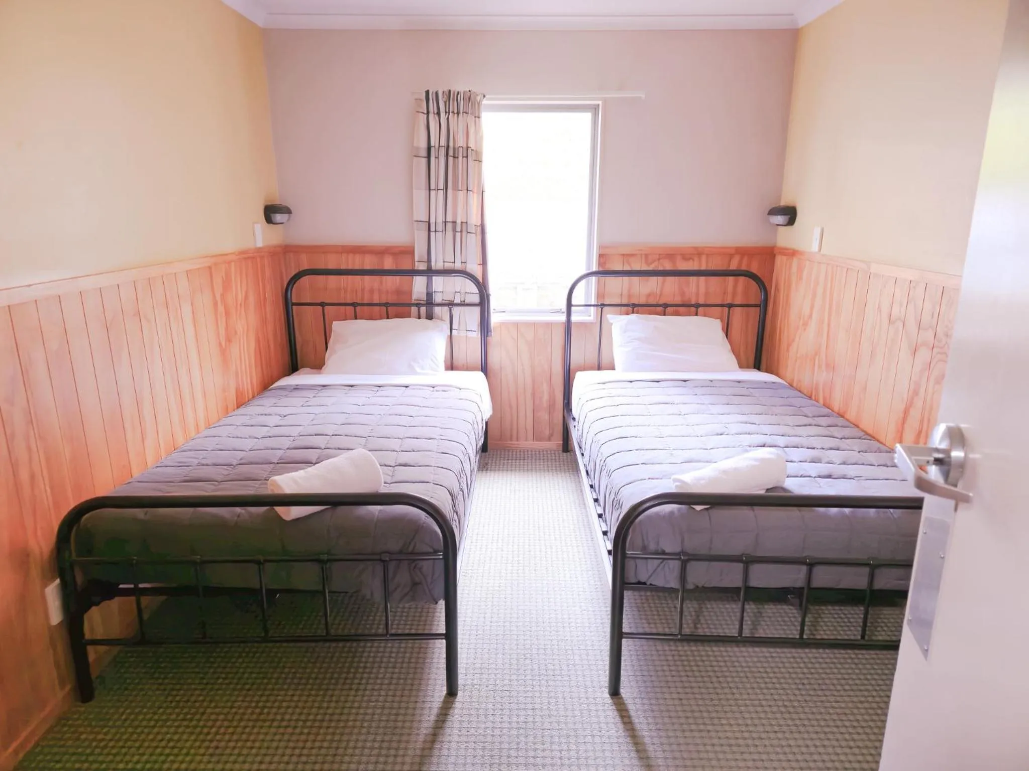 Bed in Waitomo Village Chalets home of Kiwipaka