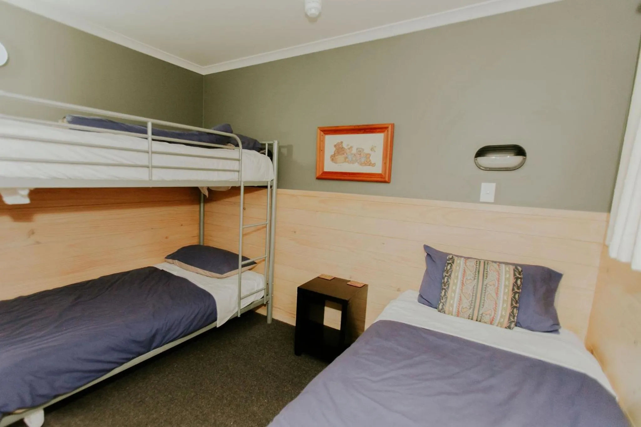 Bedroom, Bed in Waitomo Village Chalets home of Kiwipaka