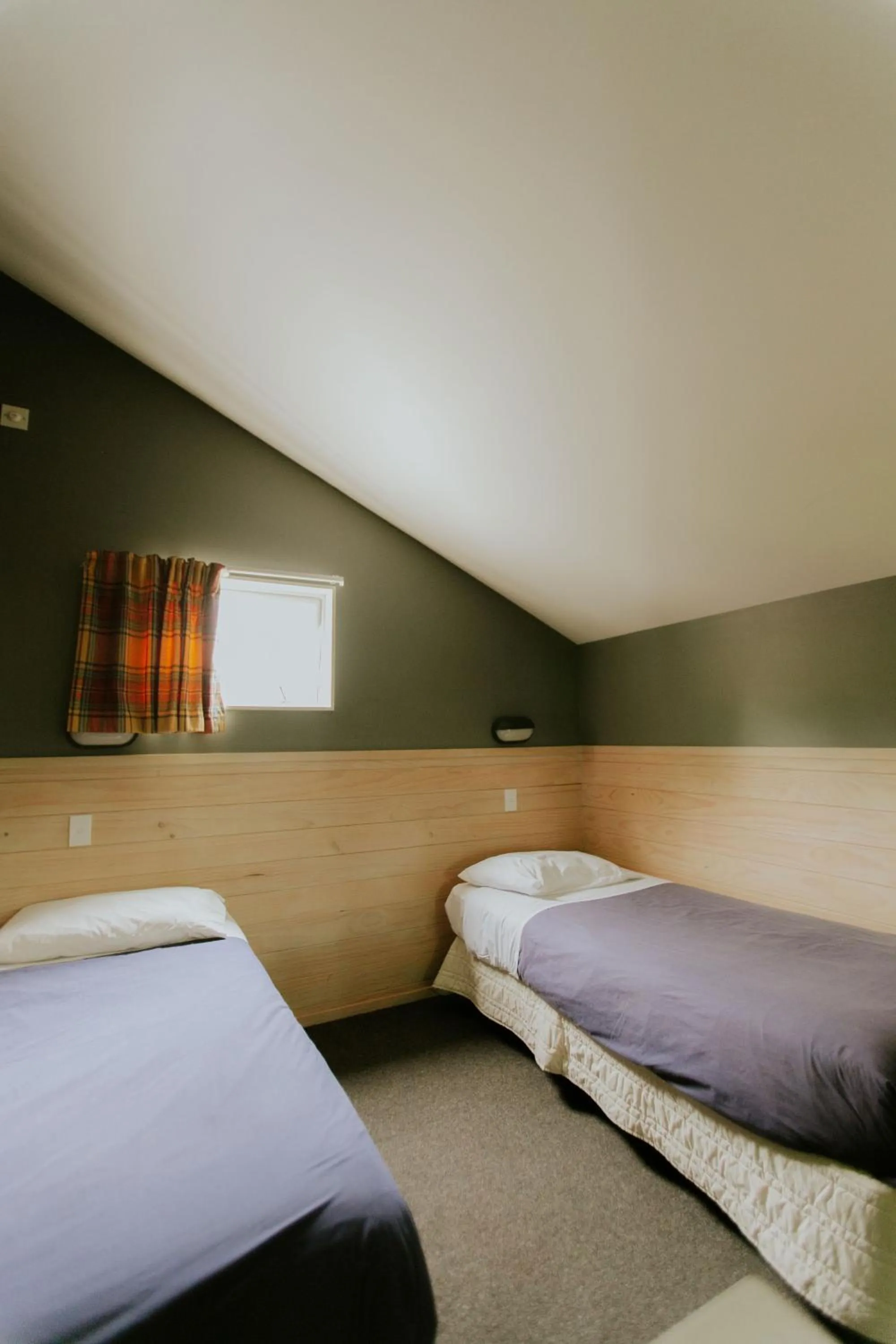 Bedroom, Bed in Waitomo Village Chalets home of Kiwipaka
