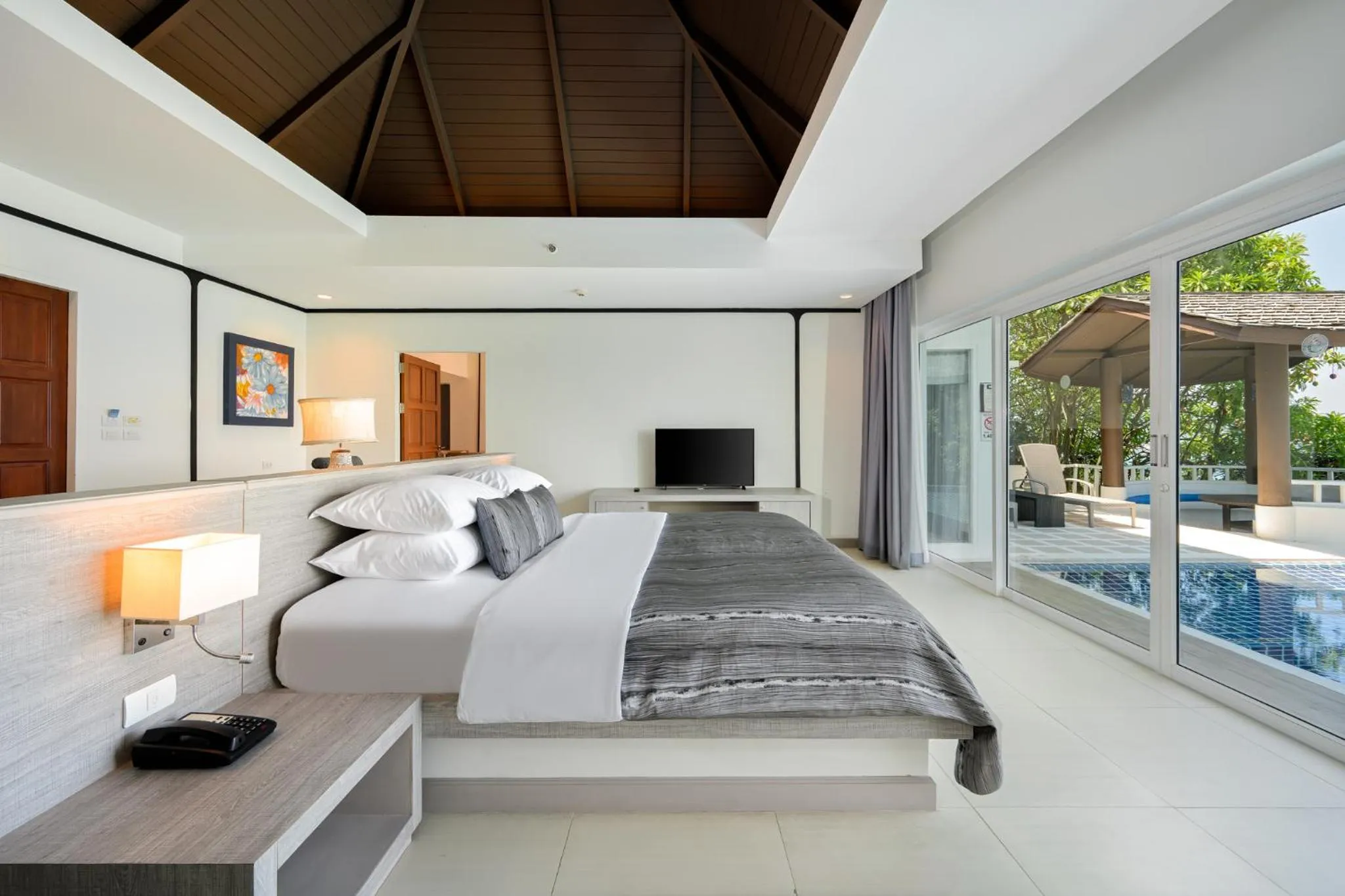 Bed in Andamantra Resort and Villa Phuket
