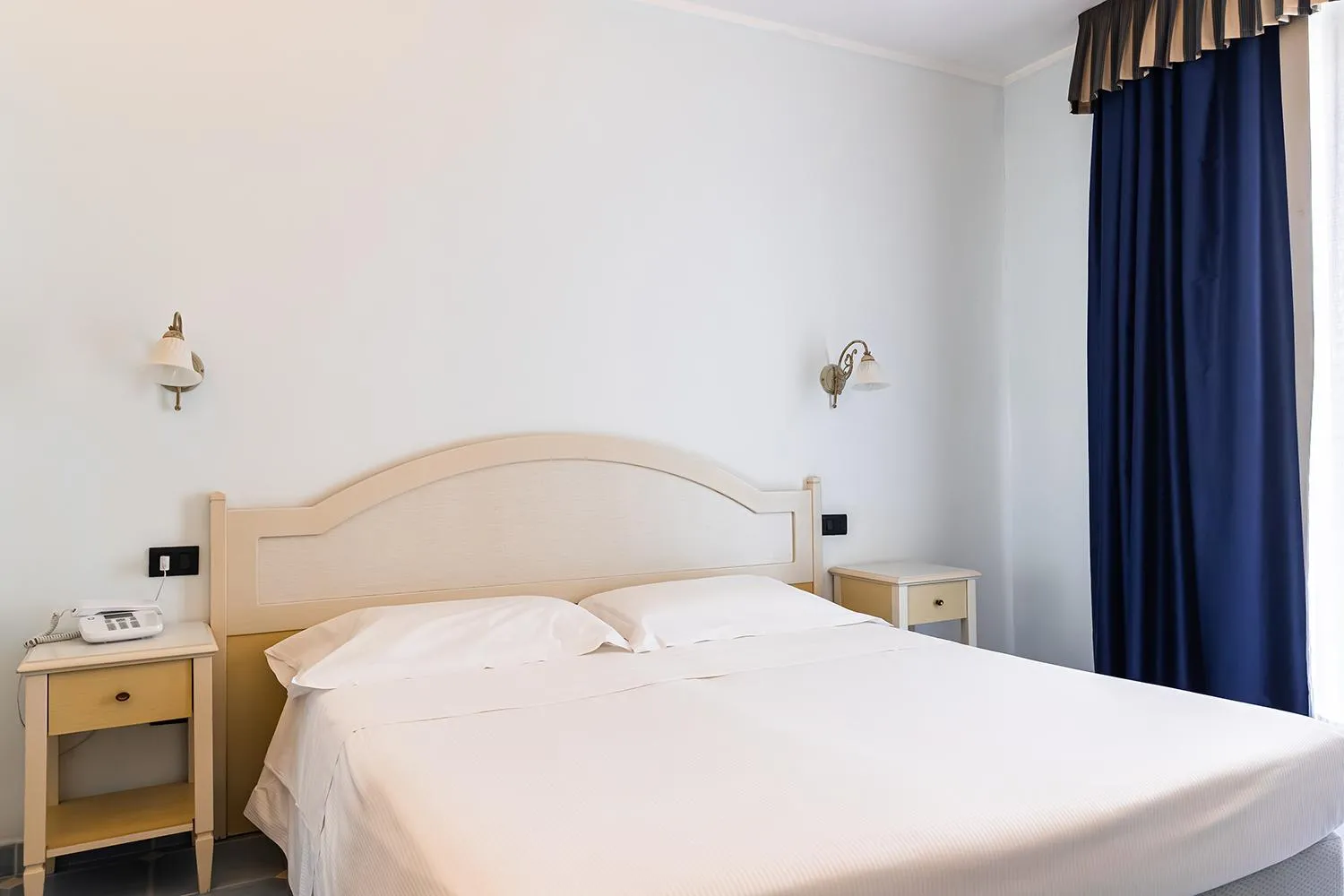 Bed in Baia dei Mulini Resort & Spa