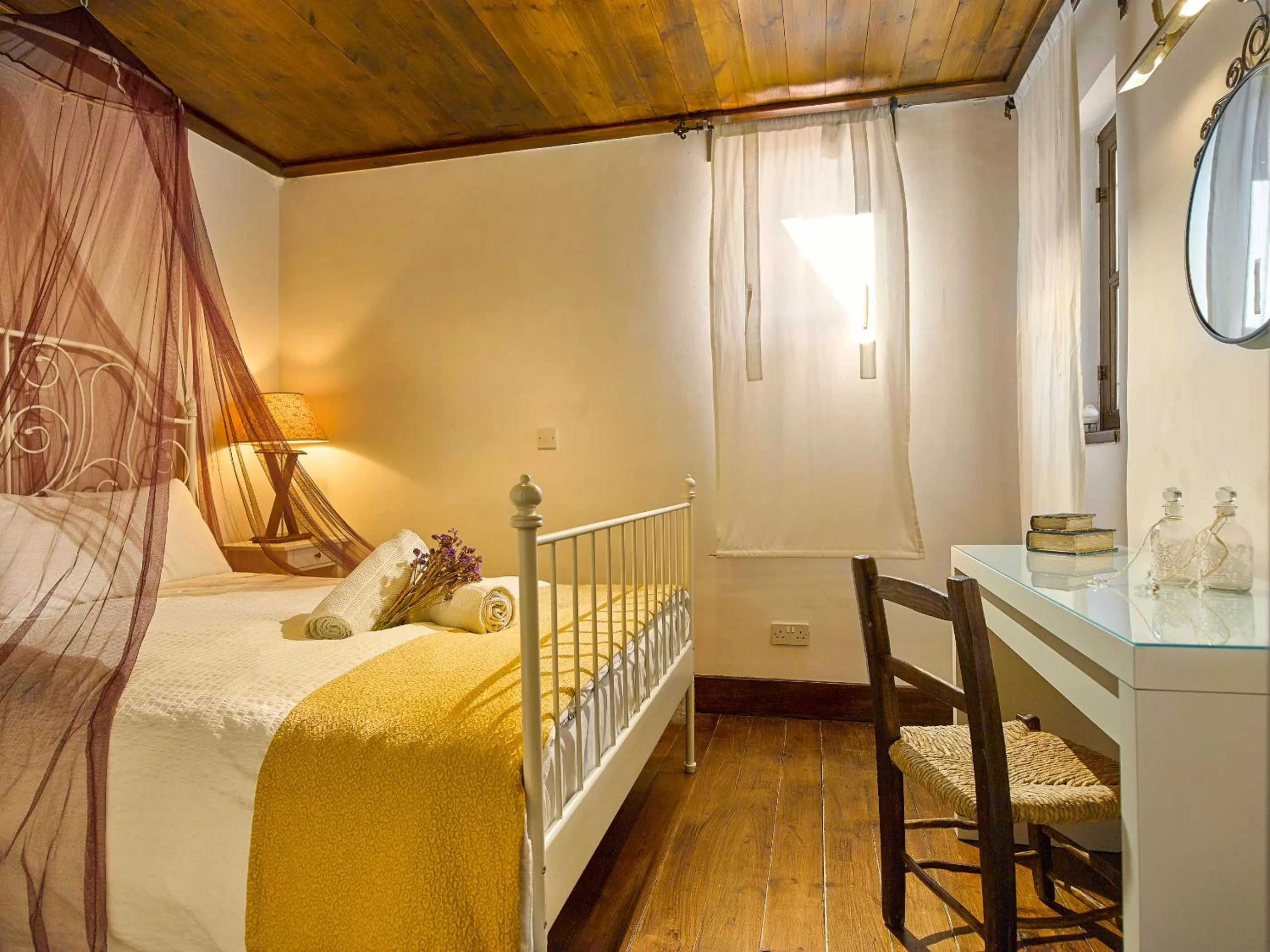 Bed in Oinoessa Traditional Boutique Guest Houses